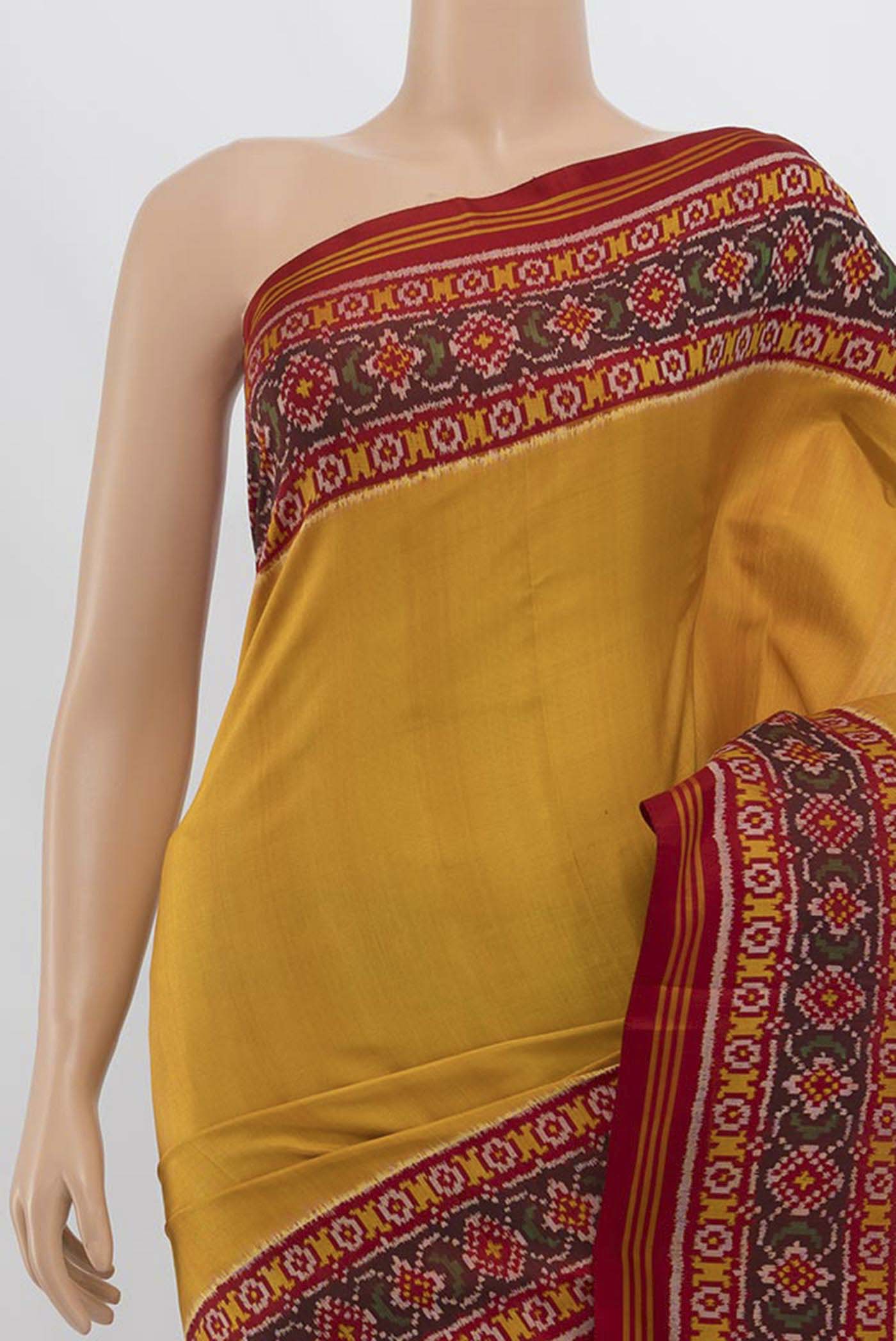 Border image of Yellow Rajkot Patola Silk Saree with Ikat Print on the body and Silk Border. 