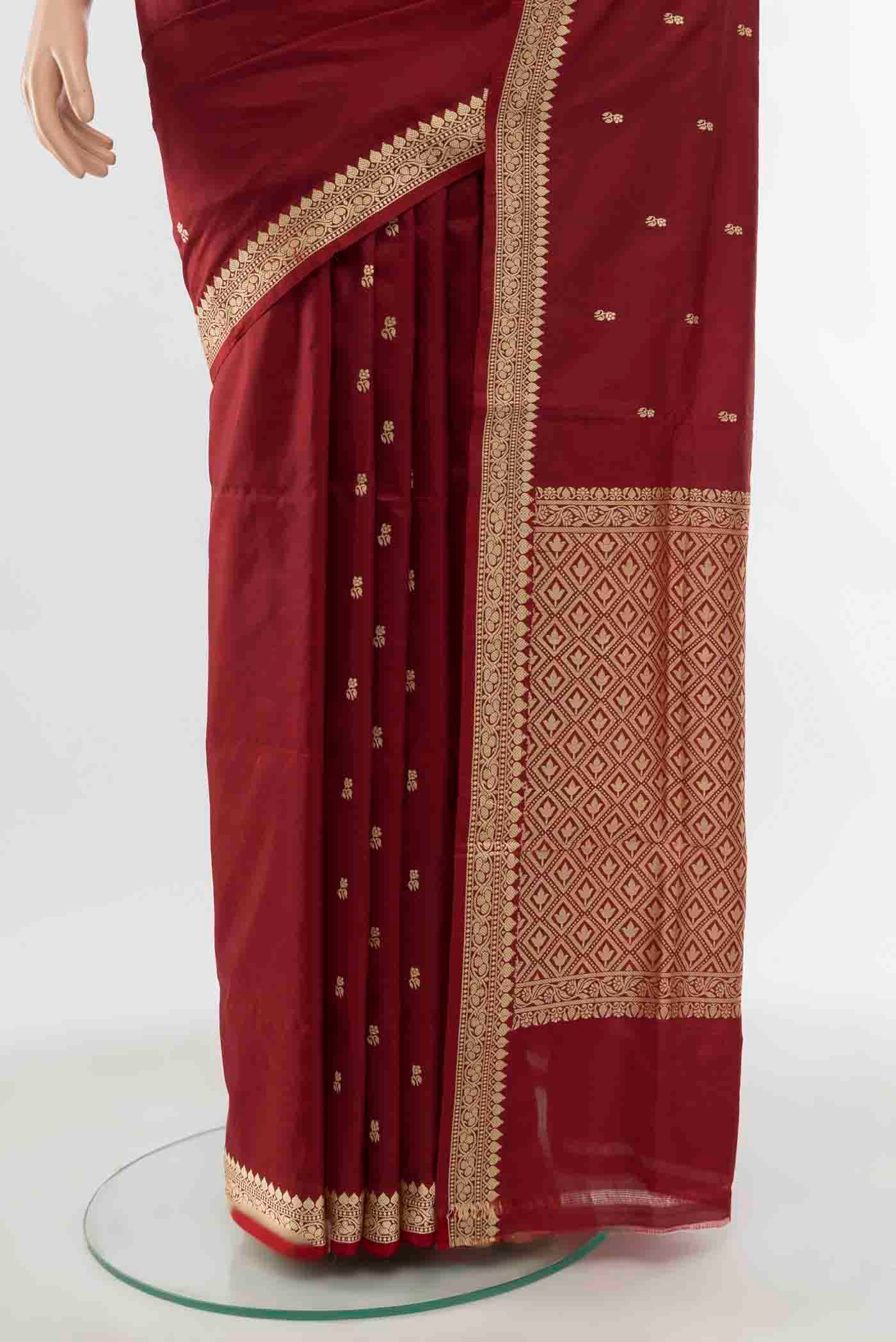 Pleats and pallu of Maroon Banarasi Katan Silk Saree with Thread Butta on the body and Thread Border