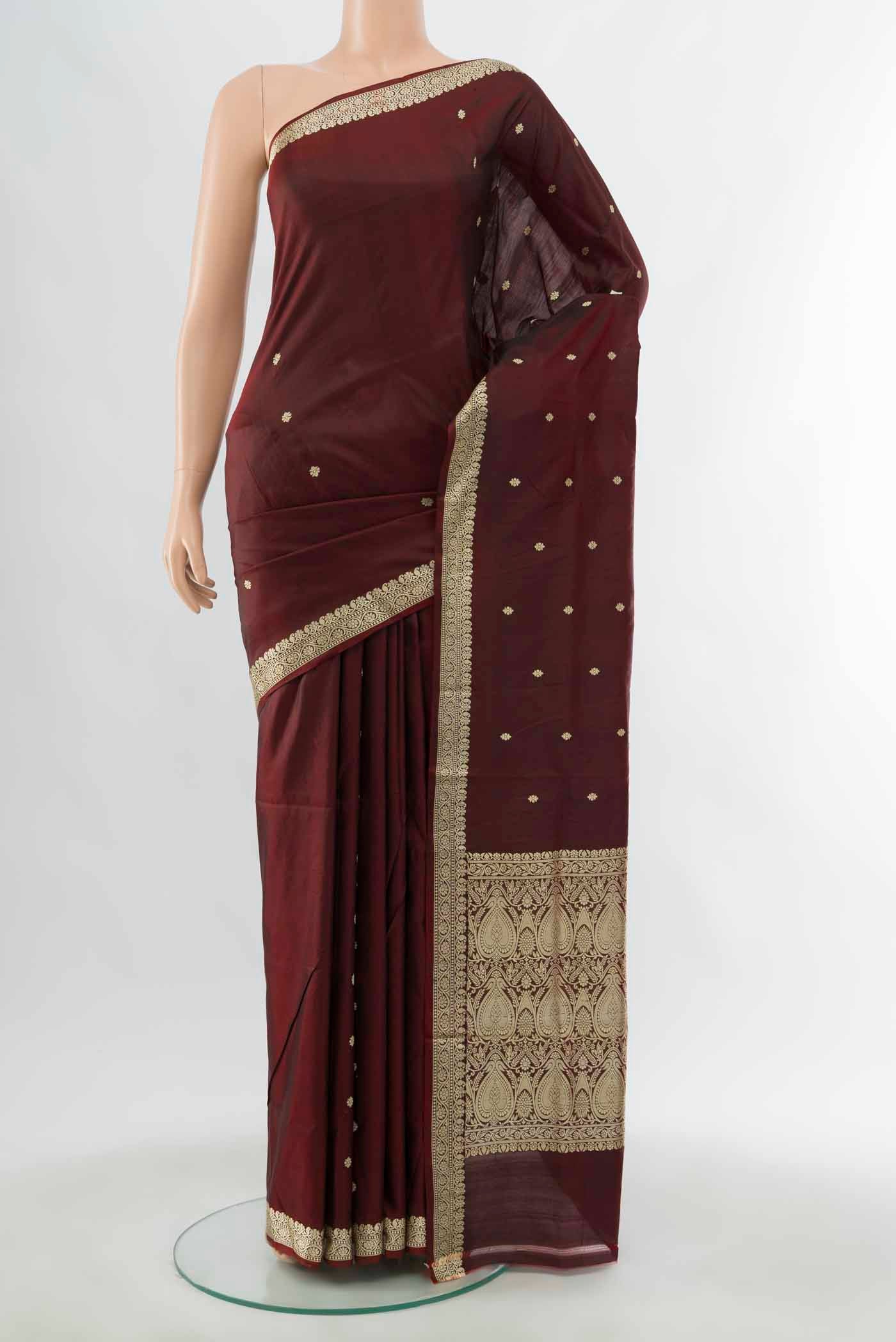 Maroon Banarasi Katan Silk Saree with Zari Butta on the body and Silk Border displayed on a mannequin