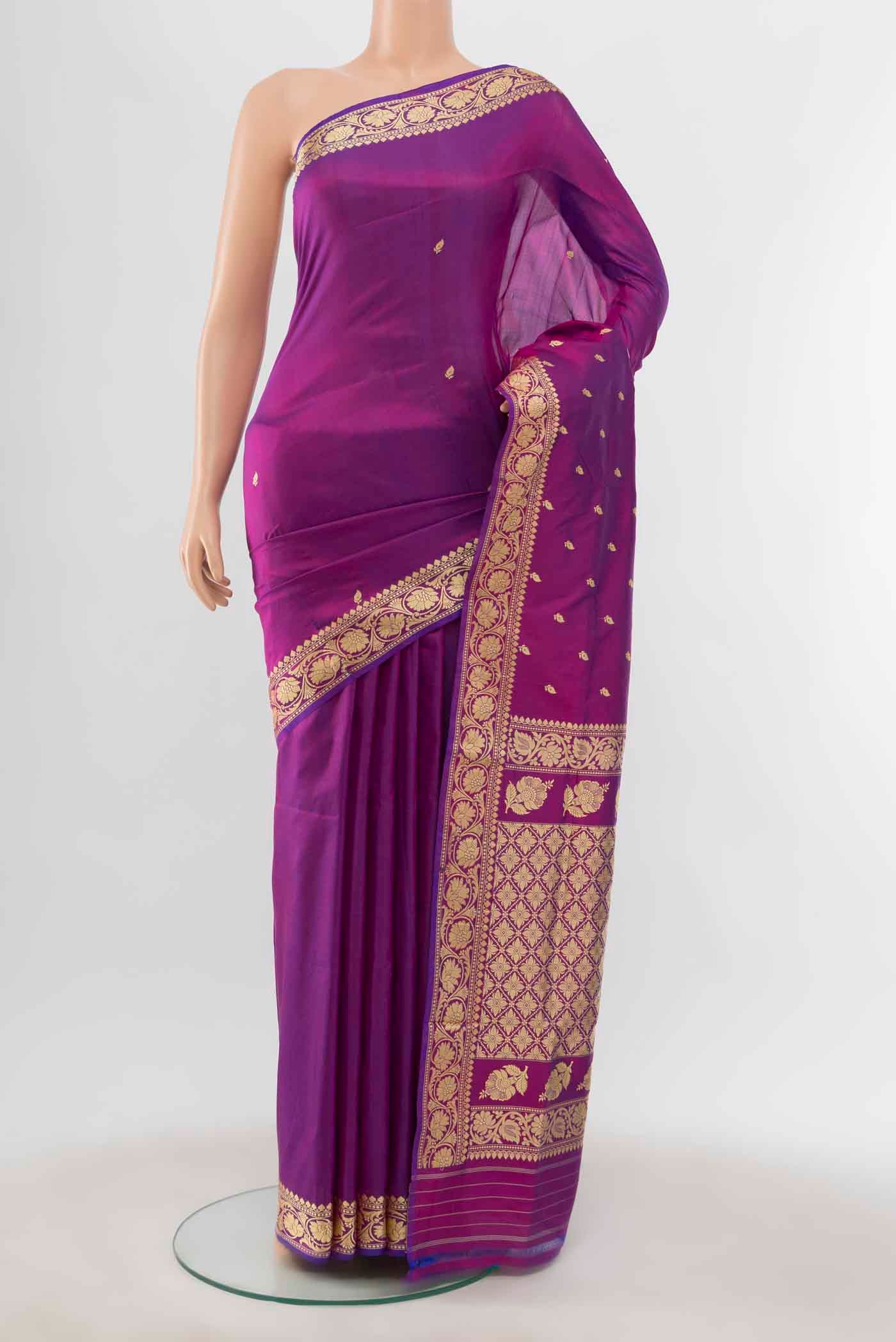 Magenta Banarasi Katan Silk Saree with Zari Butta on the body and Silk Border displayed on a mannequin
