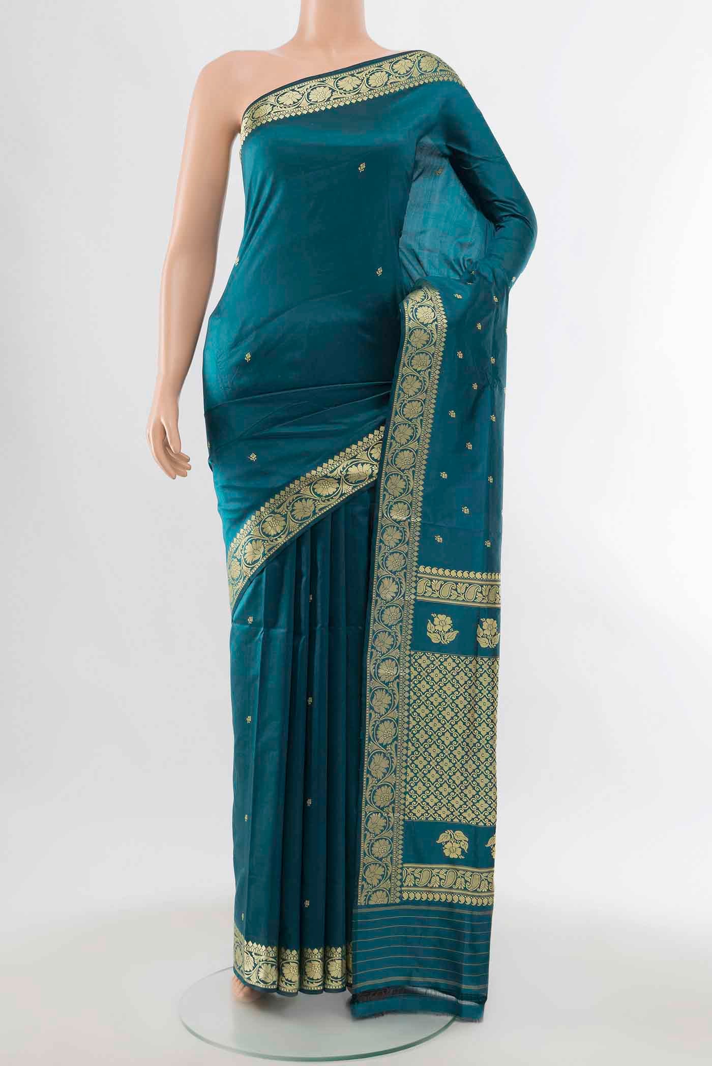 Light Blue Banarasi Katan Silk Saree with Zari Butta on the body and Zari Border displayed on a mannequin