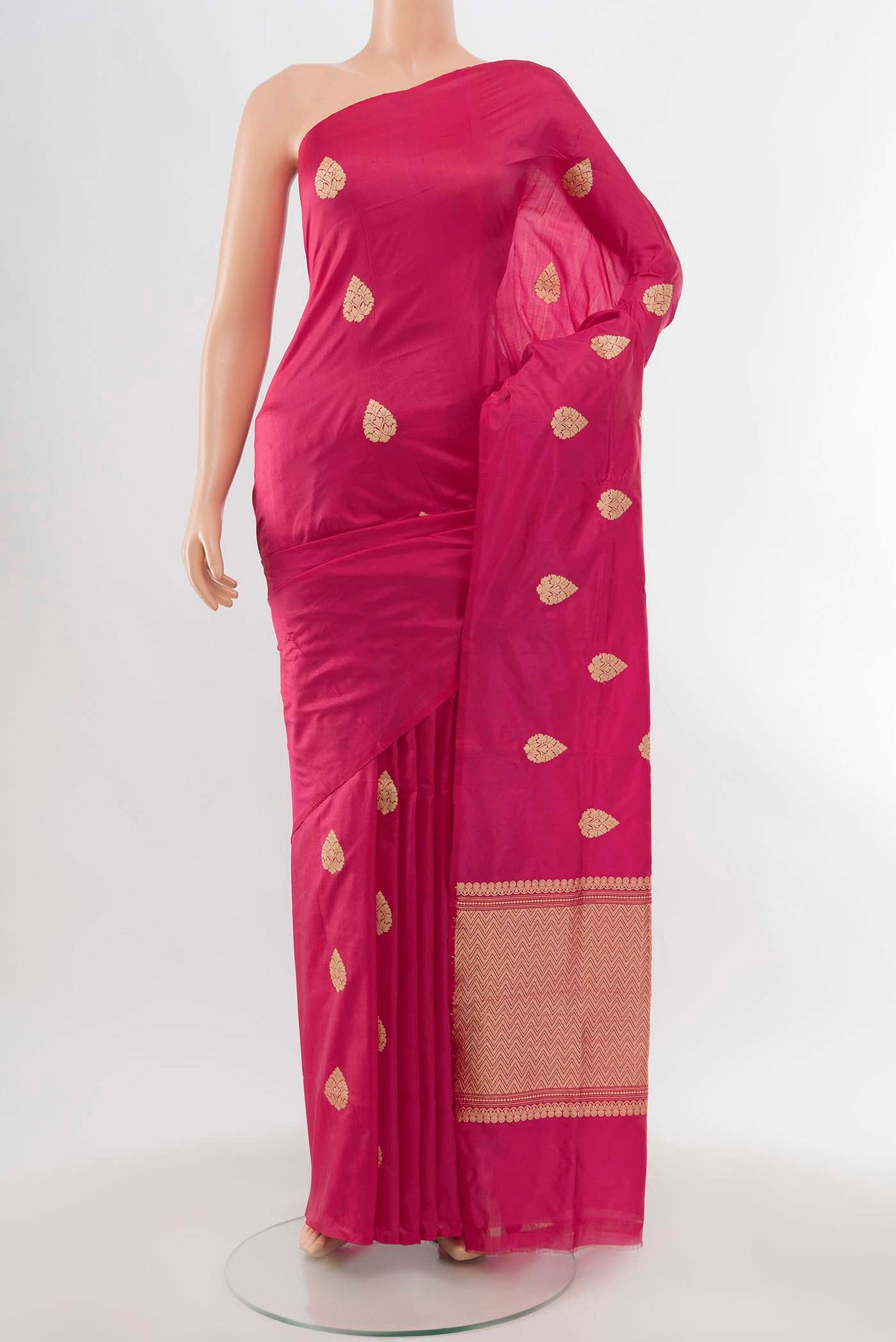 Dark Pink Banarasi Katan Silk Saree with Zari Butta on the body and Zari Border displayed on a mannequin