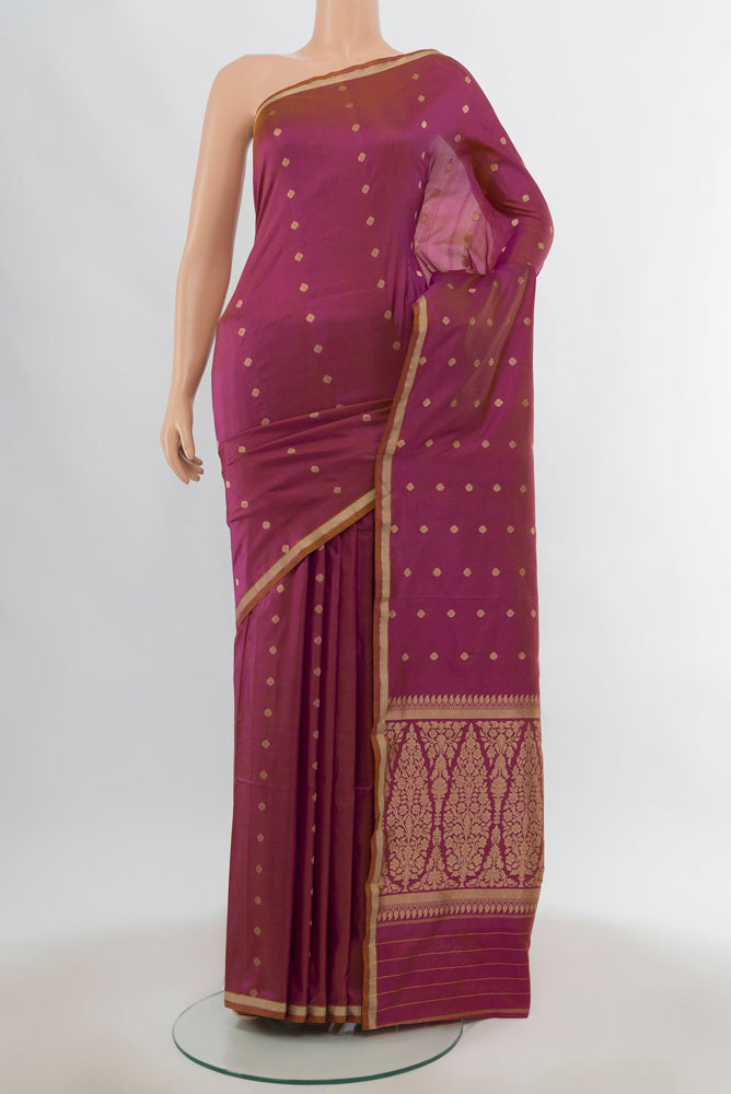 Light Magenta Banarasi Katan Silk Saree with Zari Butta on the body and Silk Border.  displayed on a mannequin