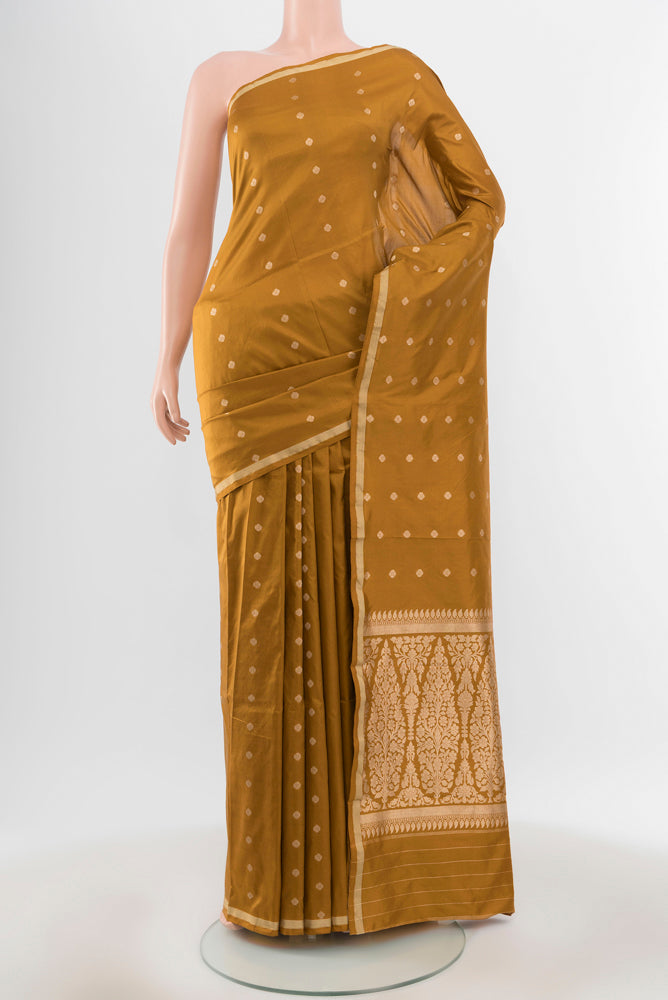 Pure Silk Pure Zari Mehandi Green Banarasi Katan Saree with Zari Butta on the body and Silk Border.  displayed on a mannequin