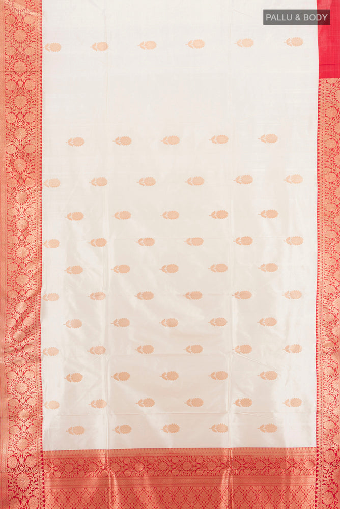 Flat view of Cream Banarasi Katan Silk Saree with Zari Butta on the body and Silk Border. 