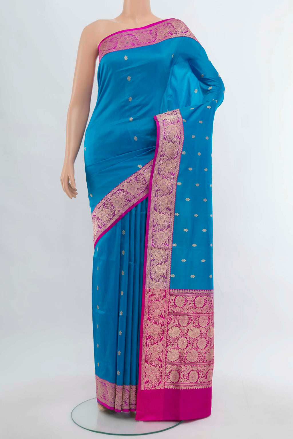 Light Blue Banarasi Katan Silk Saree with Zari Butta on the body and Silk Border.  displayed on a mannequin