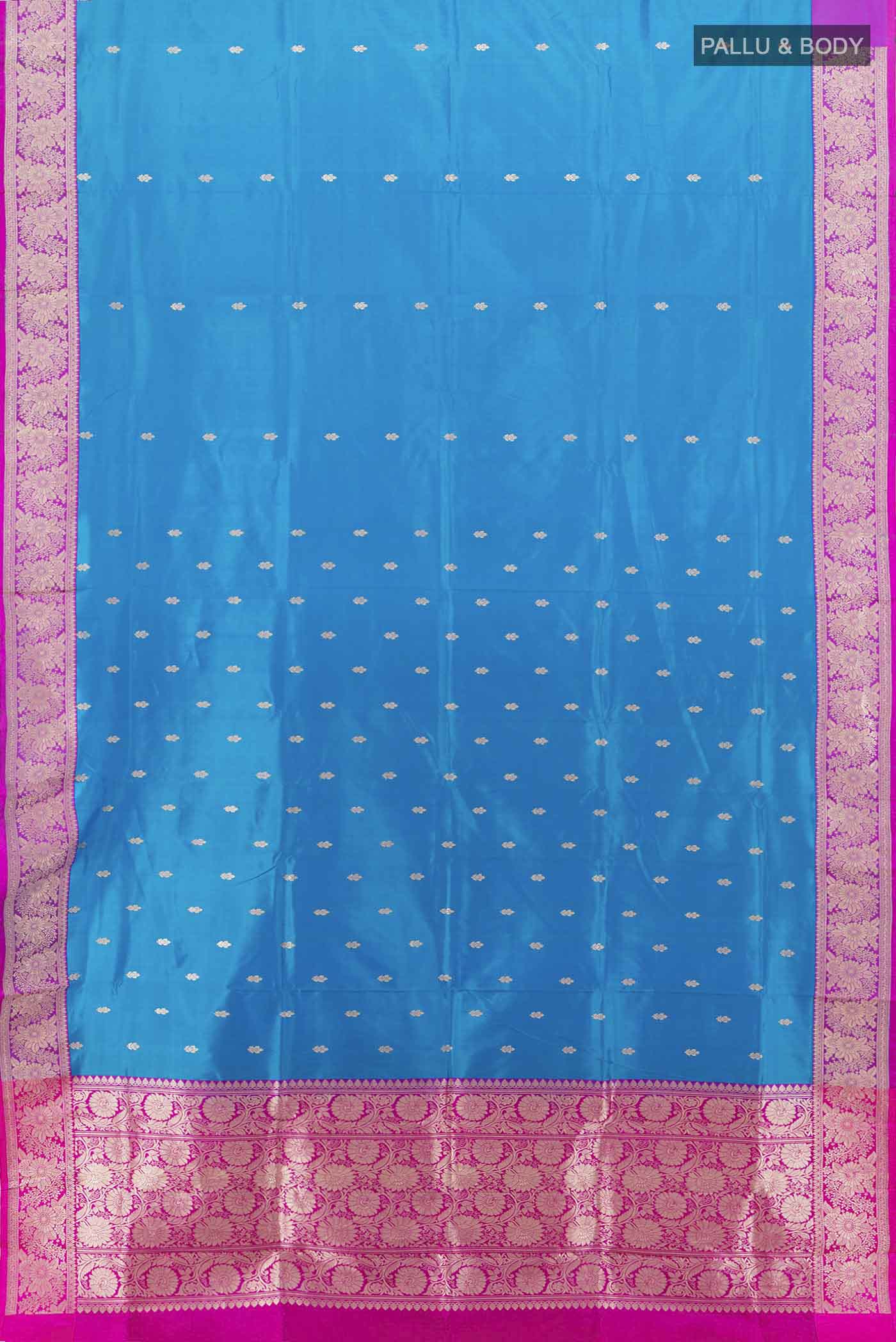 Flat view of Light Blue Banarasi Katan Silk Saree with Zari Butta on the body and Silk Border. 