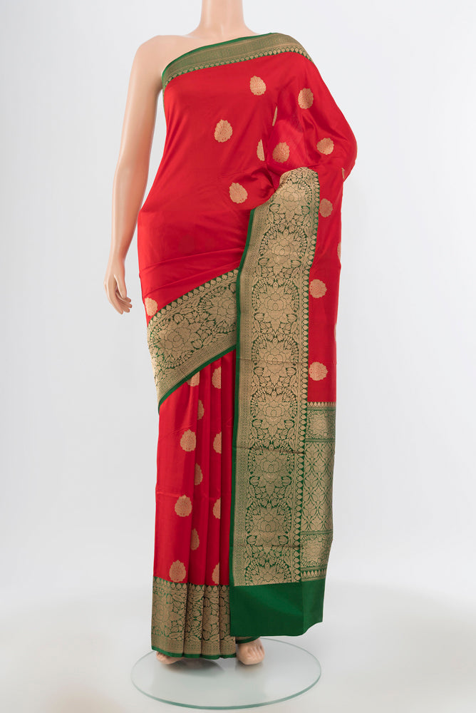 Pure Silk Pure Zari Red Banarasi Katan Saree with Zari Butta on the body and Silk Border.  displayed on a mannequin