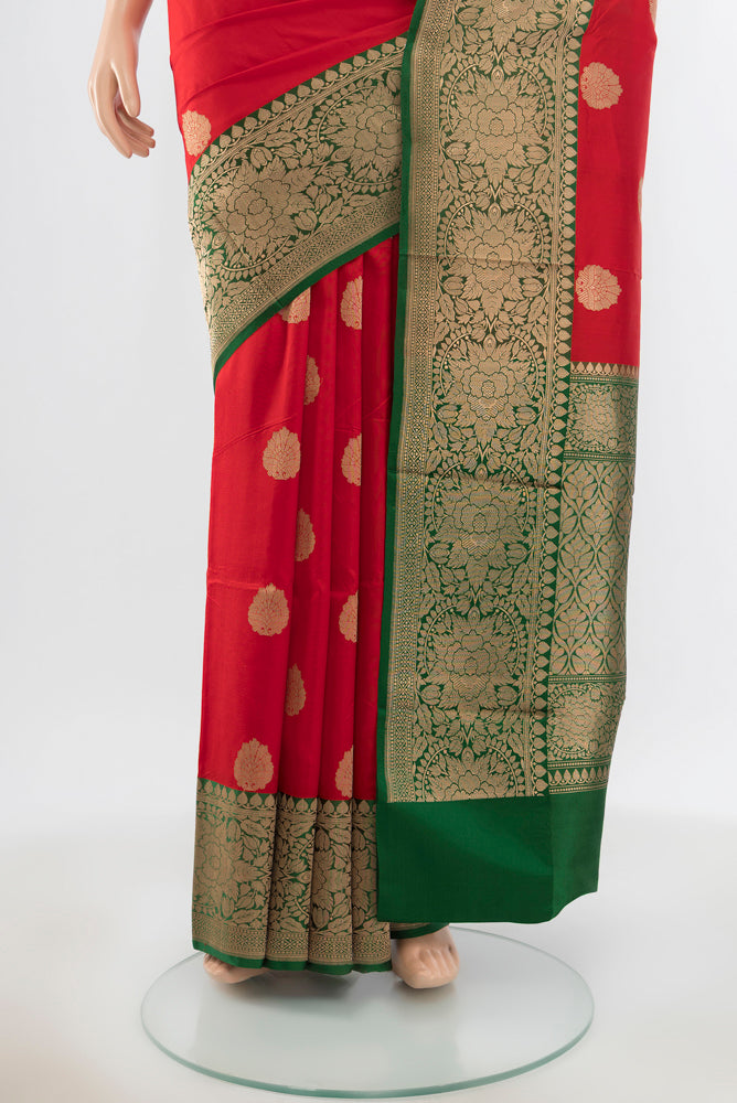 Pleats and pallu of Pure Silk Pure Zari Red Banarasi Katan Saree with Zari Butta on the body and Silk Border. 