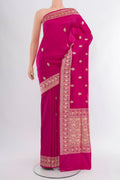 Dark Pink Banarasi Katan Silk Saree with Zari Butta on the body and Zari Border.  displayed on a mannequin