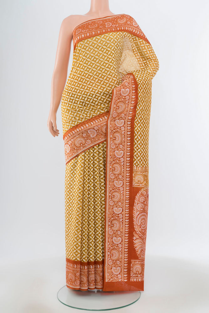 Pure Silk Pure Zari Mehandi Green Banarasi Georgette Saree with Jacquard With Thread Butta on the body and Silk Border.  displayed on a mannequin