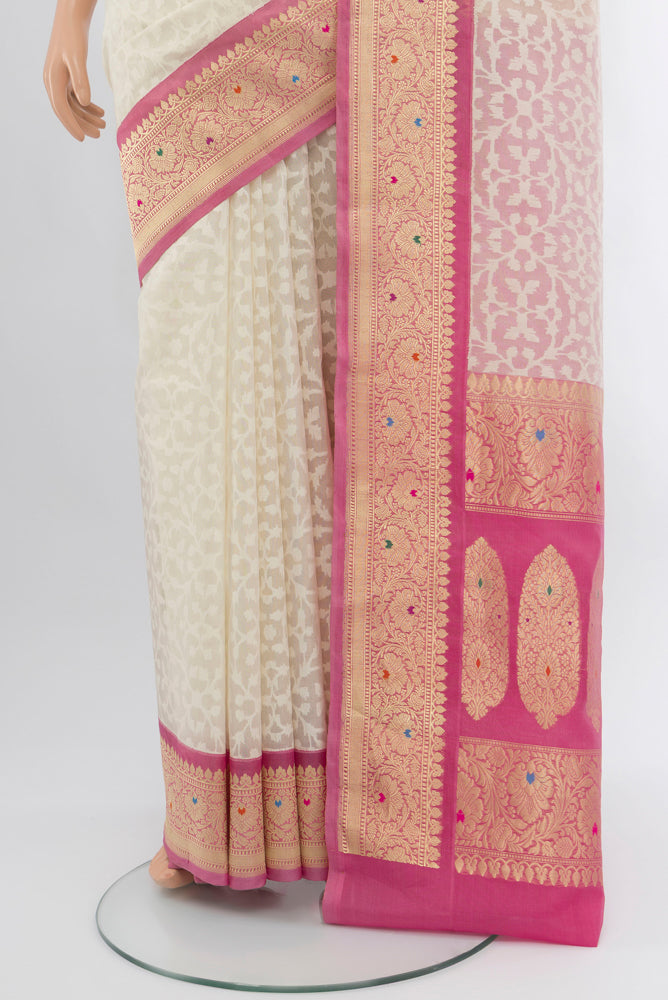 Pleats and pallu of Cream Banarasi Kota Silk Saree with Zari Butta on the body and Silk Border. 