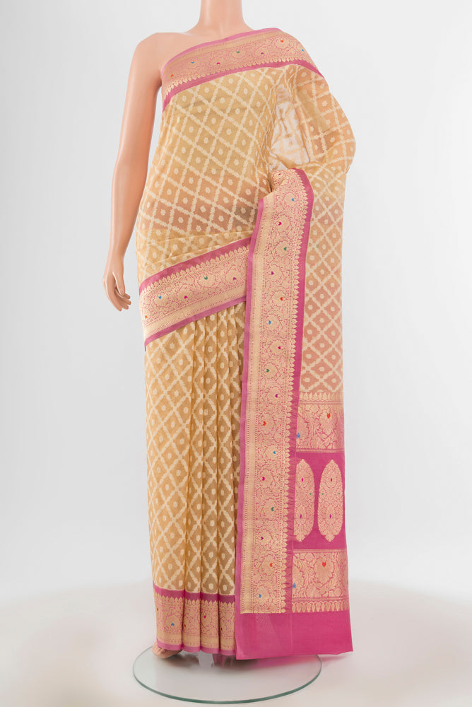 Beige Banarasi Kora Silk Saree with Zari Butta on the body and Silk Border.  displayed on a mannequin