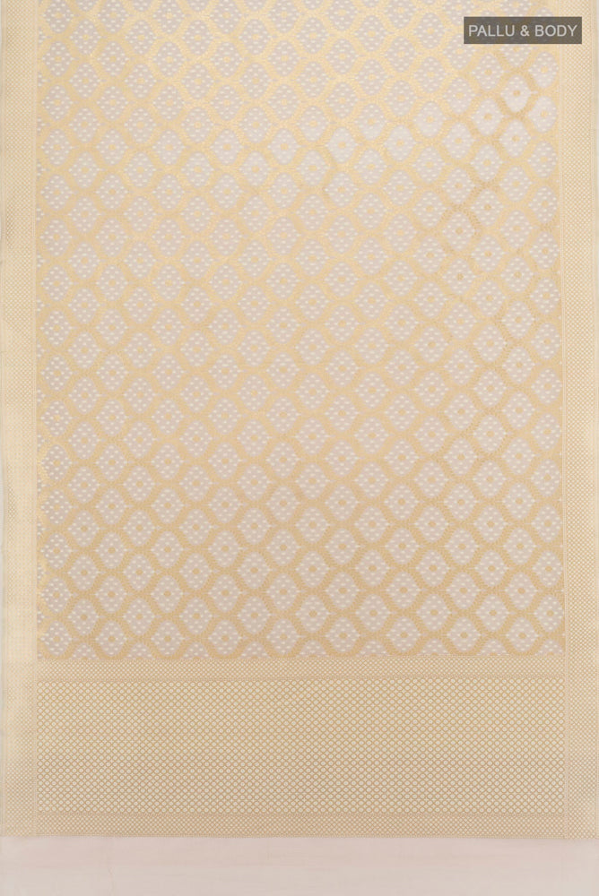 Flat view of Pure Silk Pure Zari Cream Banarasi Saree with Zari Butta on the body and Silk Border. 