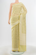 Pure Silk Pure Zari Pista Green Banarasi Saree with Zari Butta on the body and Silk Border.  displayed on a mannequin