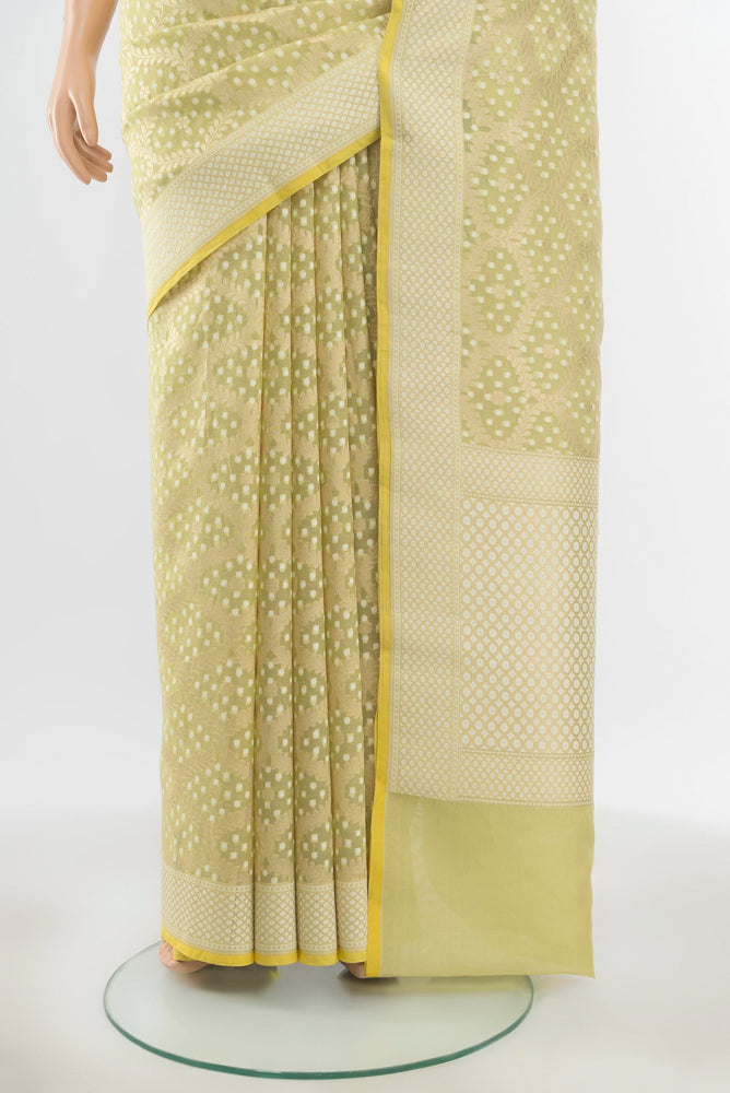 Pleats and pallu of Pure Silk Pure Zari Pista Green Banarasi Saree with Zari Butta on the body and Silk Border. 