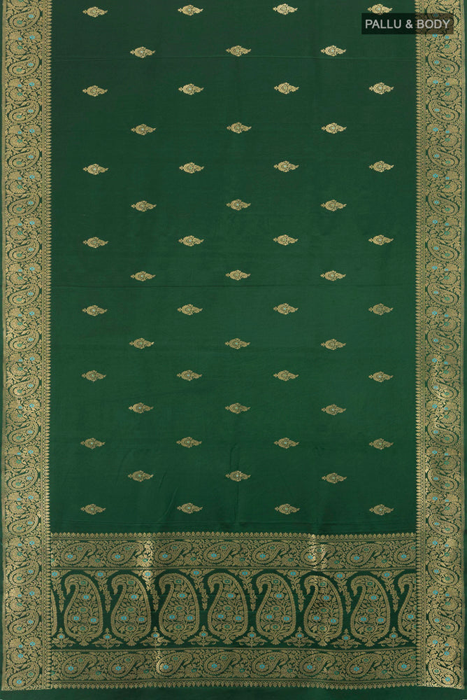 Flat view of Pure Silk Pure Zari Bottle Green Banarasi Katan Saree with Zari Butta on the body and Silk Border. 