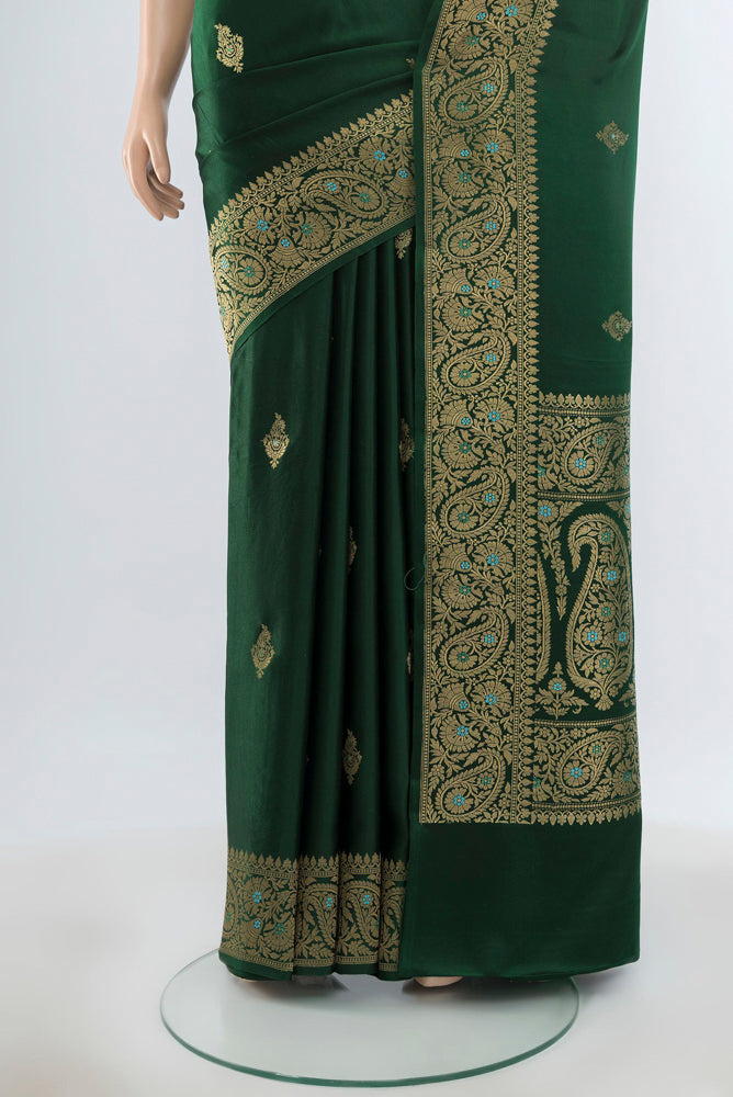 Pleats and pallu of Pure Silk Pure Zari Bottle Green Banarasi Katan Saree with Zari Butta on the body and Silk Border. 