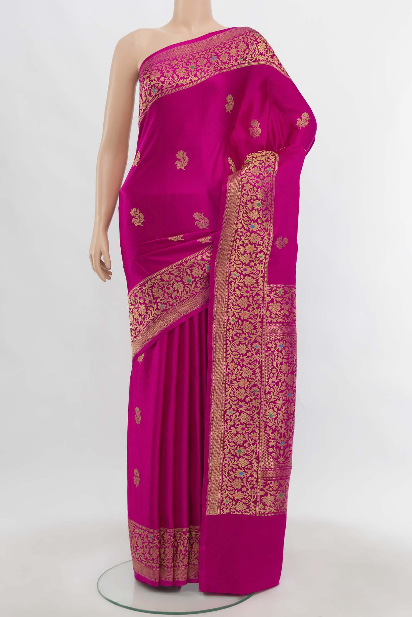 Magenta Banarasi Silk Saree with Zari Butta on the body and Zari Border.  displayed on a mannequin
