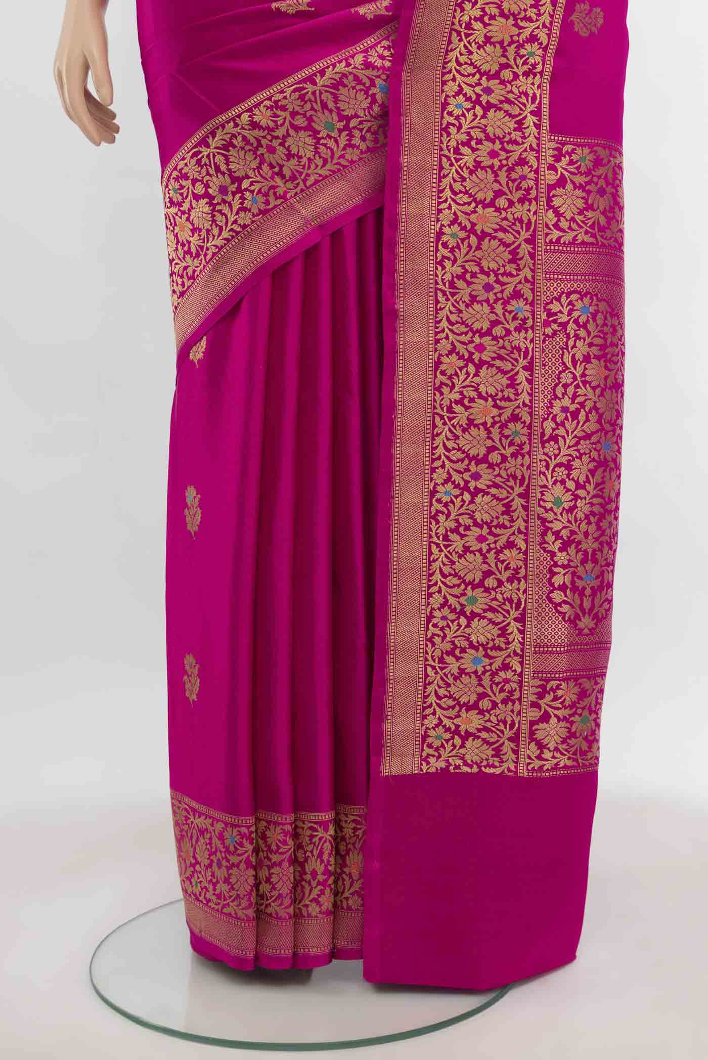 Pleats and pallu of Magenta Banarasi Silk Saree with Zari Butta on the body and Zari Border. 