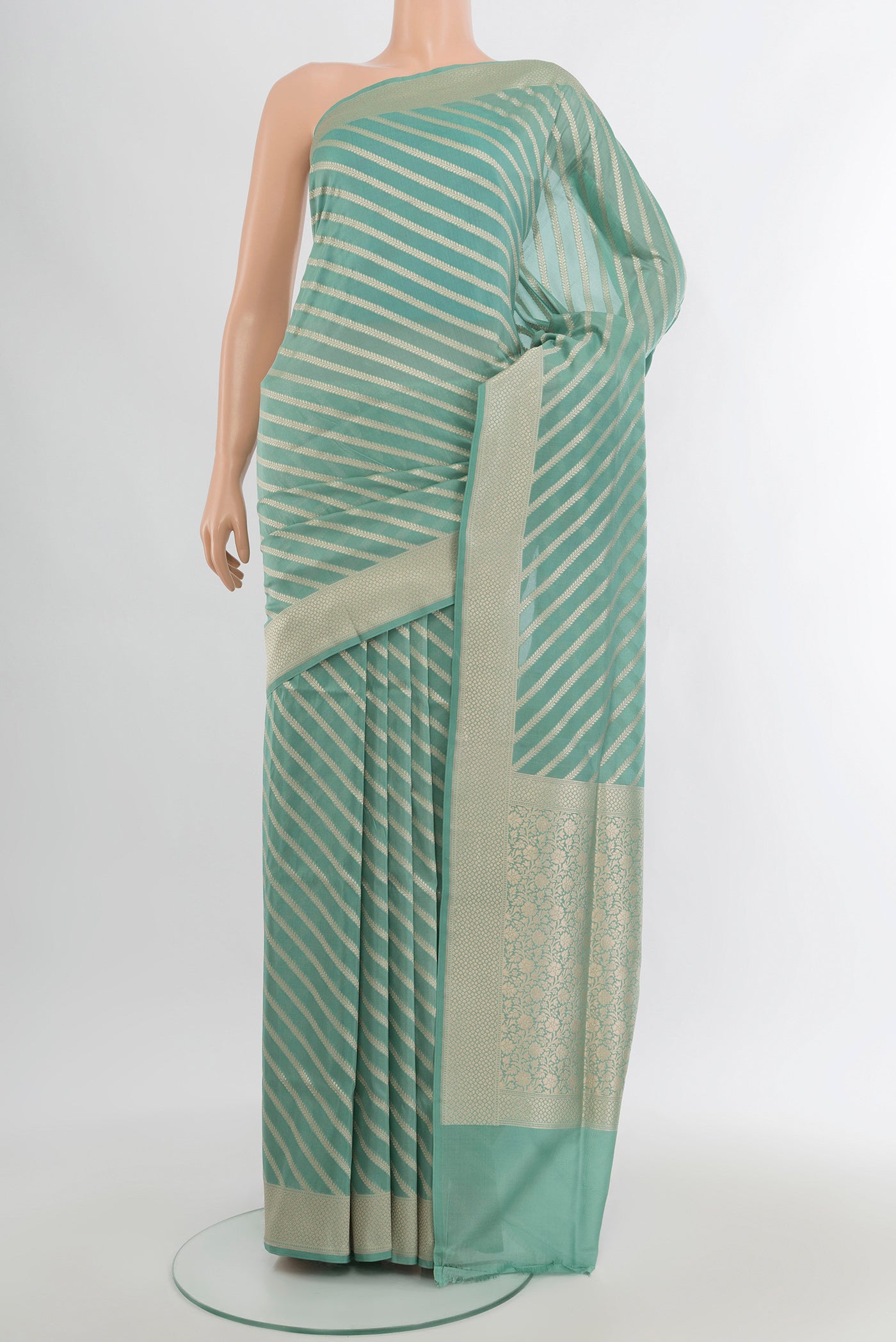 Light Blue Banarasi Silk Saree with Stripes on the body and Zari Border.  displayed on a mannequin