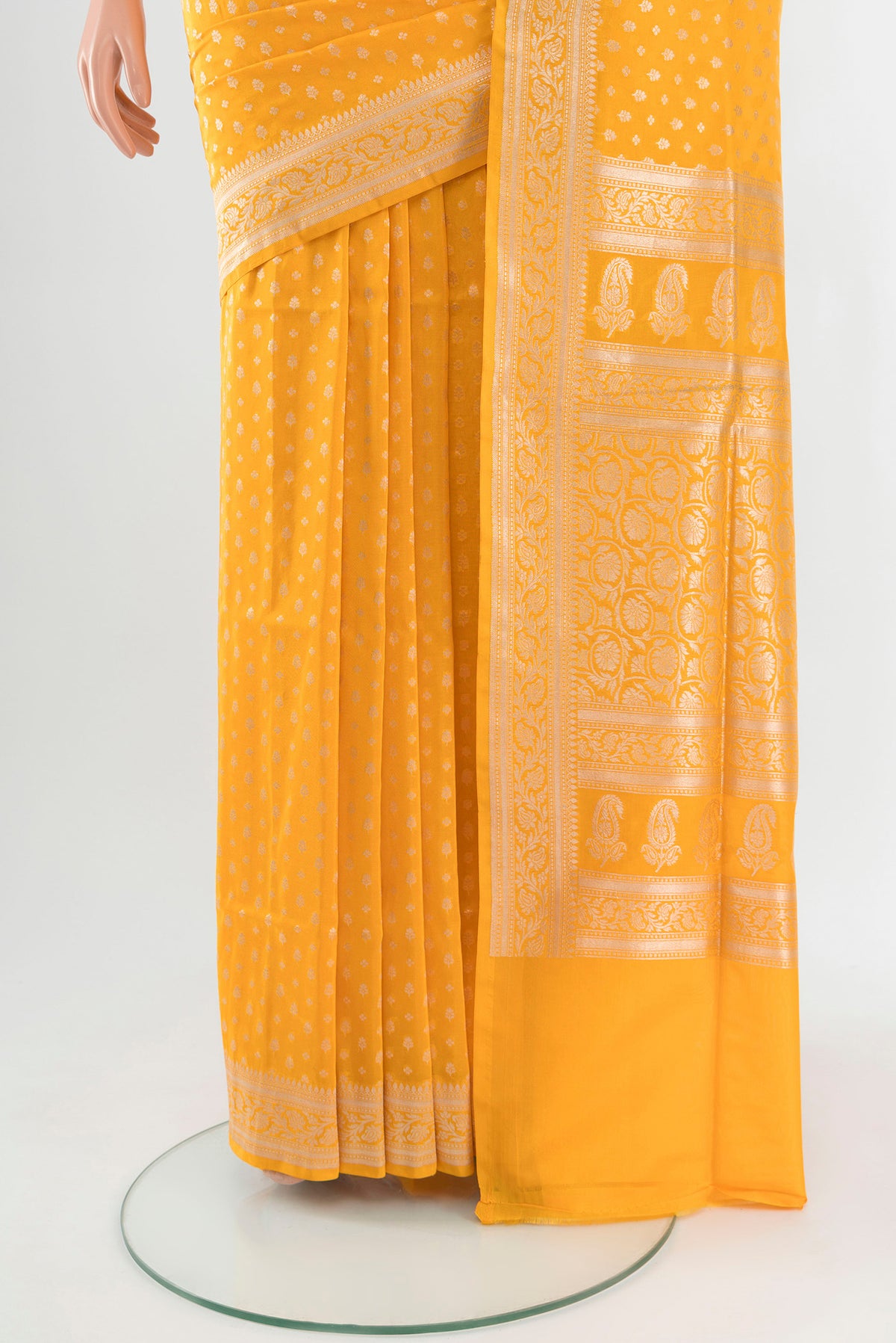 Pleats and pallu of Yellow Banarasi Silk Saree with Zari Butta on the body and Zari Border. 