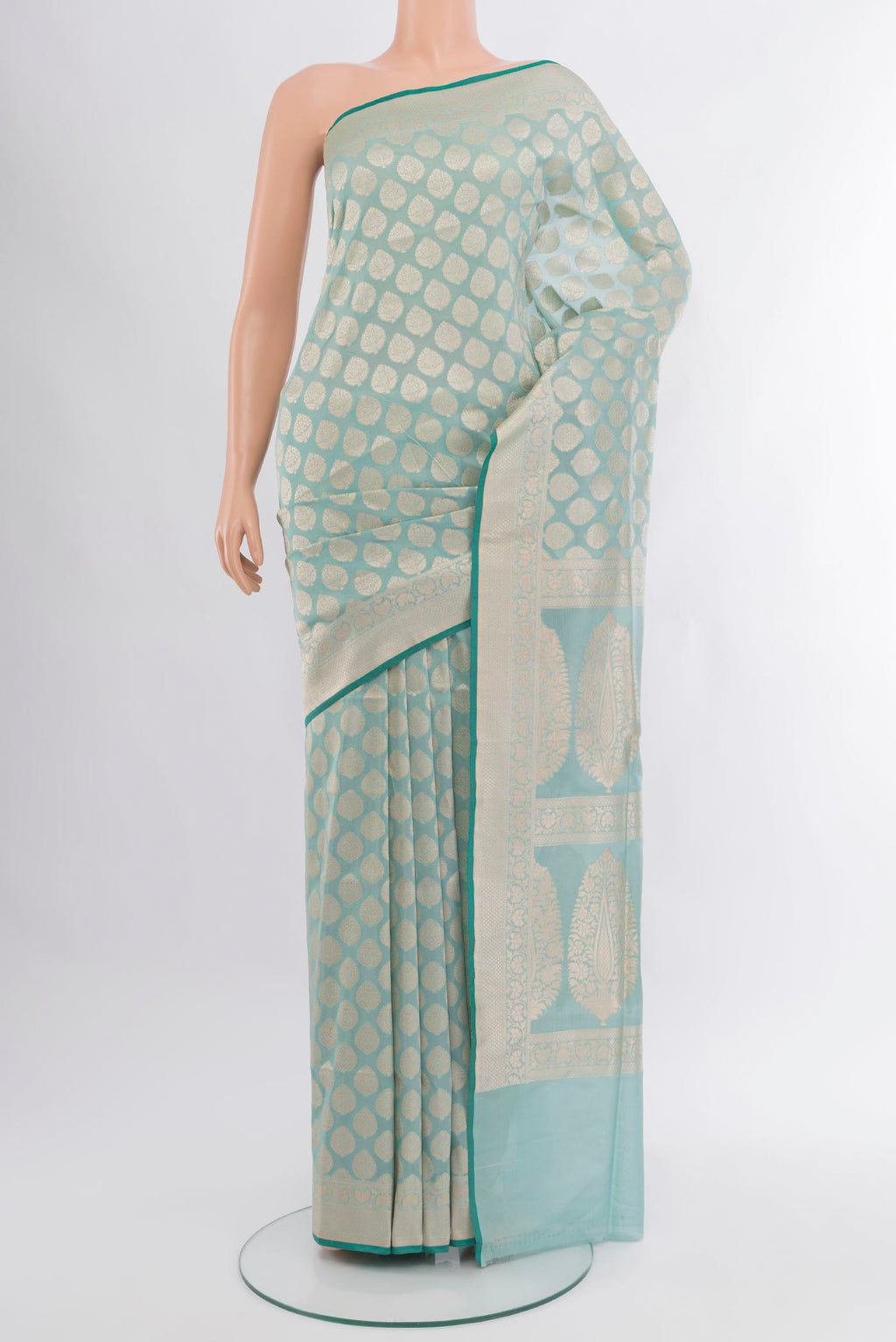 Light Blue Banarasi Silk Saree with Zari Butta on the body and Zari Border.  displayed on a mannequin