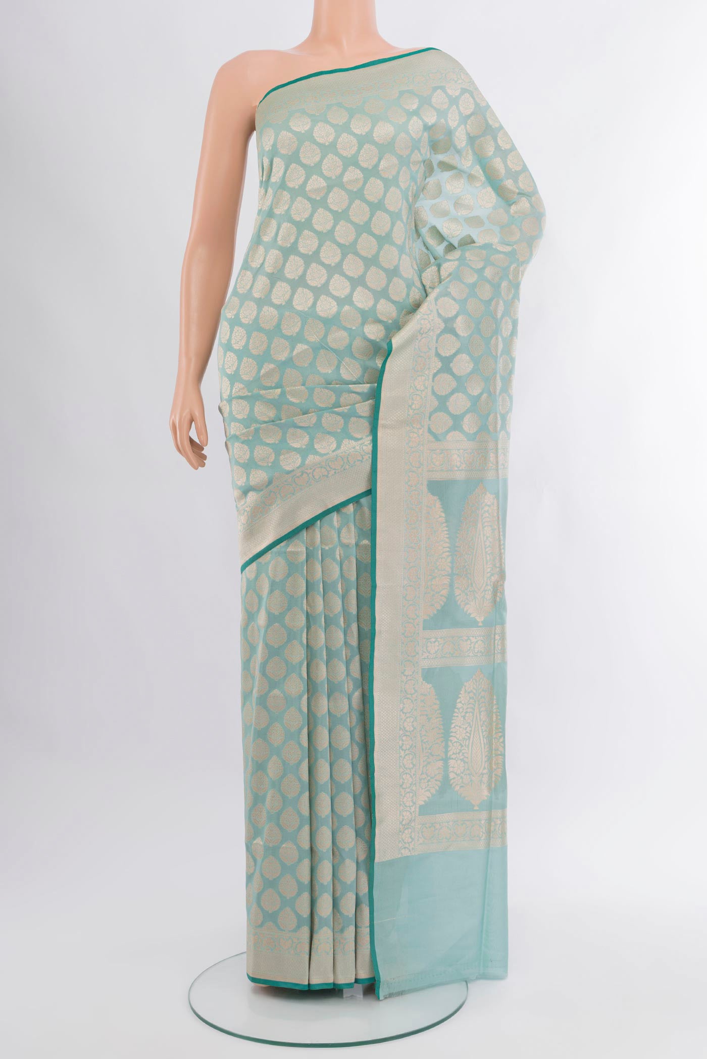 Light Blue Banarasi Silk Saree with Zari Butta on the body and Zari Border.  displayed on a mannequin