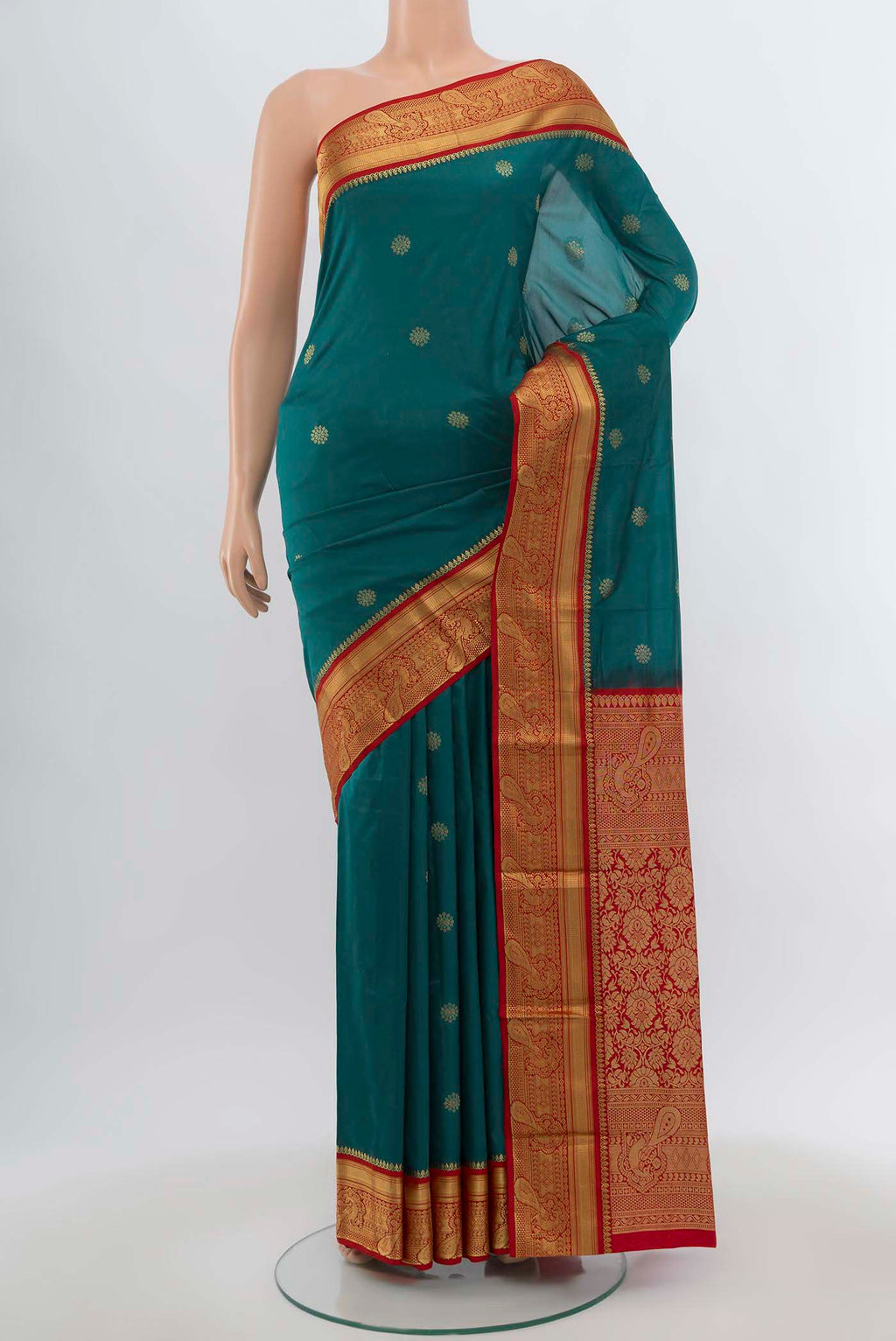 Peacock Blue Bangalore Silk Saree with Zari Butta on the body and Silk Border.  displayed on a mannequin