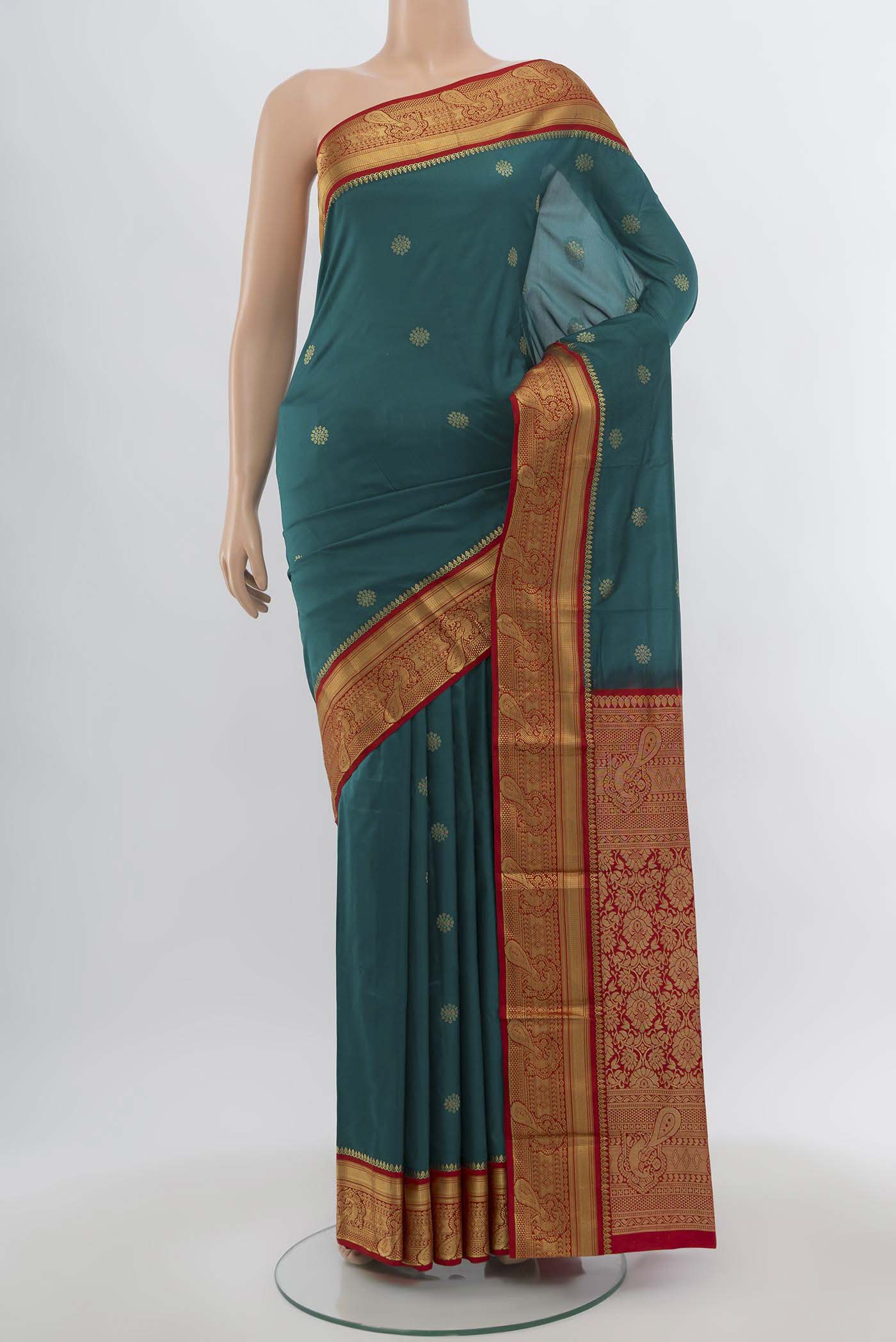 Peacock Blue Bangalore Silk Saree with Zari Butta on the body and Silk Border.  displayed on a mannequin