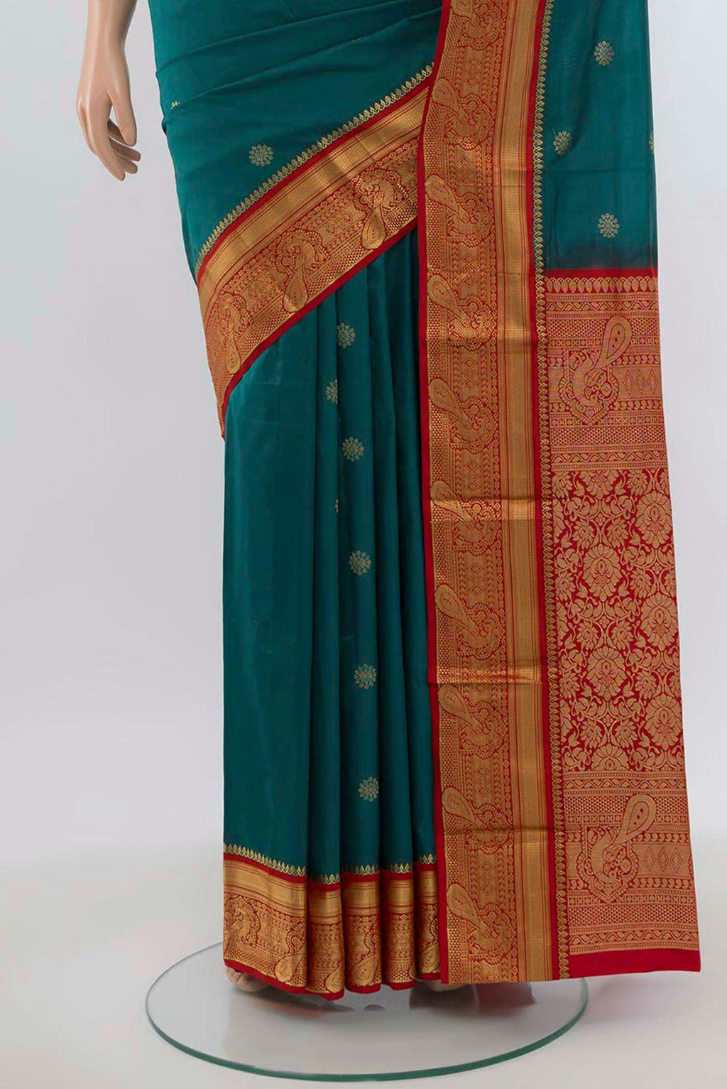 Pleats and pallu of Peacock Blue Bangalore Silk Saree with Zari Butta on the body and Silk Border. 