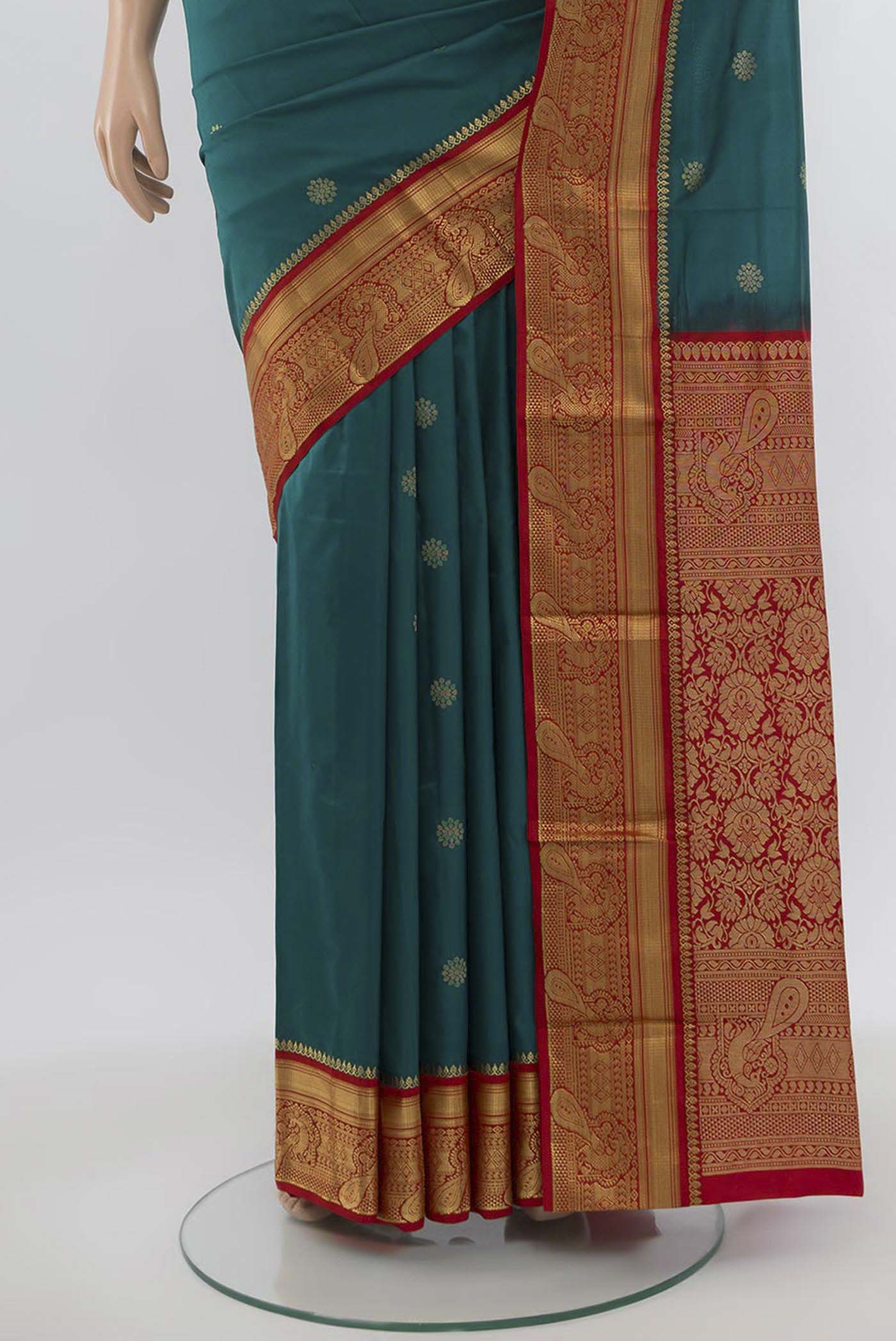 Pleats and pallu of Peacock Blue Bangalore Silk Saree with Zari Butta on the body and Silk Border. 