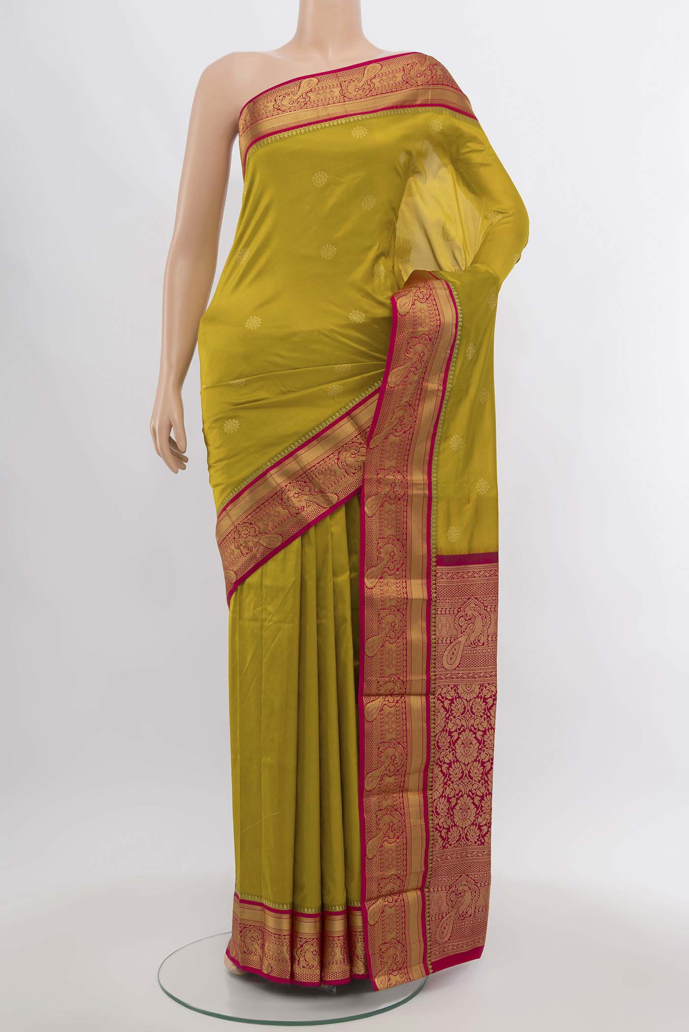 Mehandi Green Bangalore Silk Saree with Zari Butta on the body and Silk Border.  displayed on a mannequin