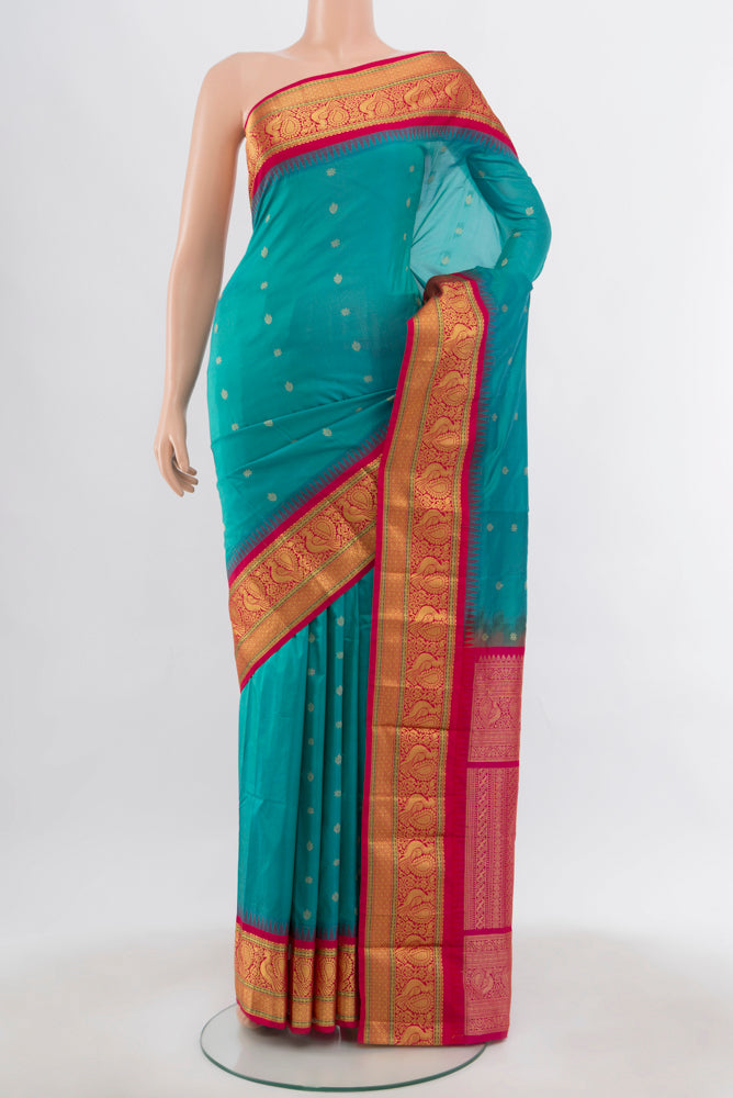 Light Blue Bangalore Silk Saree with Zari Butta on the body and Silk Border.  displayed on a mannequin