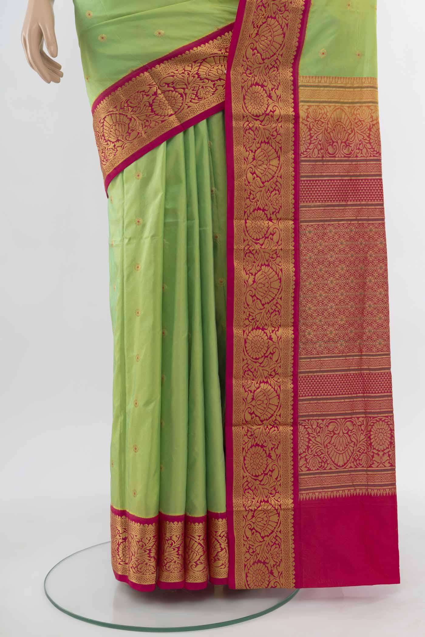 Pleats and pallu of Parrot Green Bangalore Silk Saree with Zari Butta on the body and Silk Border. 