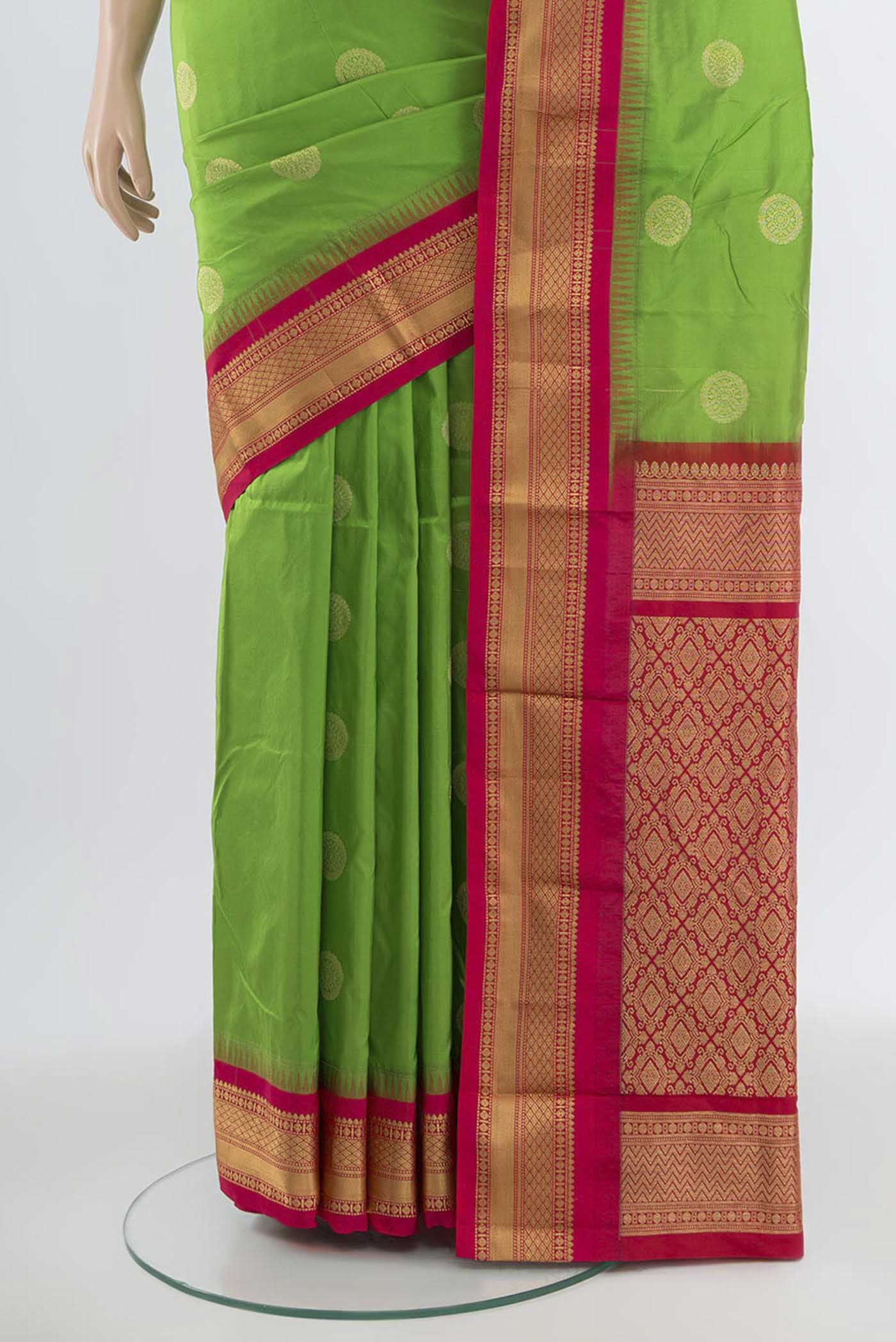Pleats and pallu of Parrot Green Bangalore Silk Saree with Zari Butta on the body and Silk Border. 