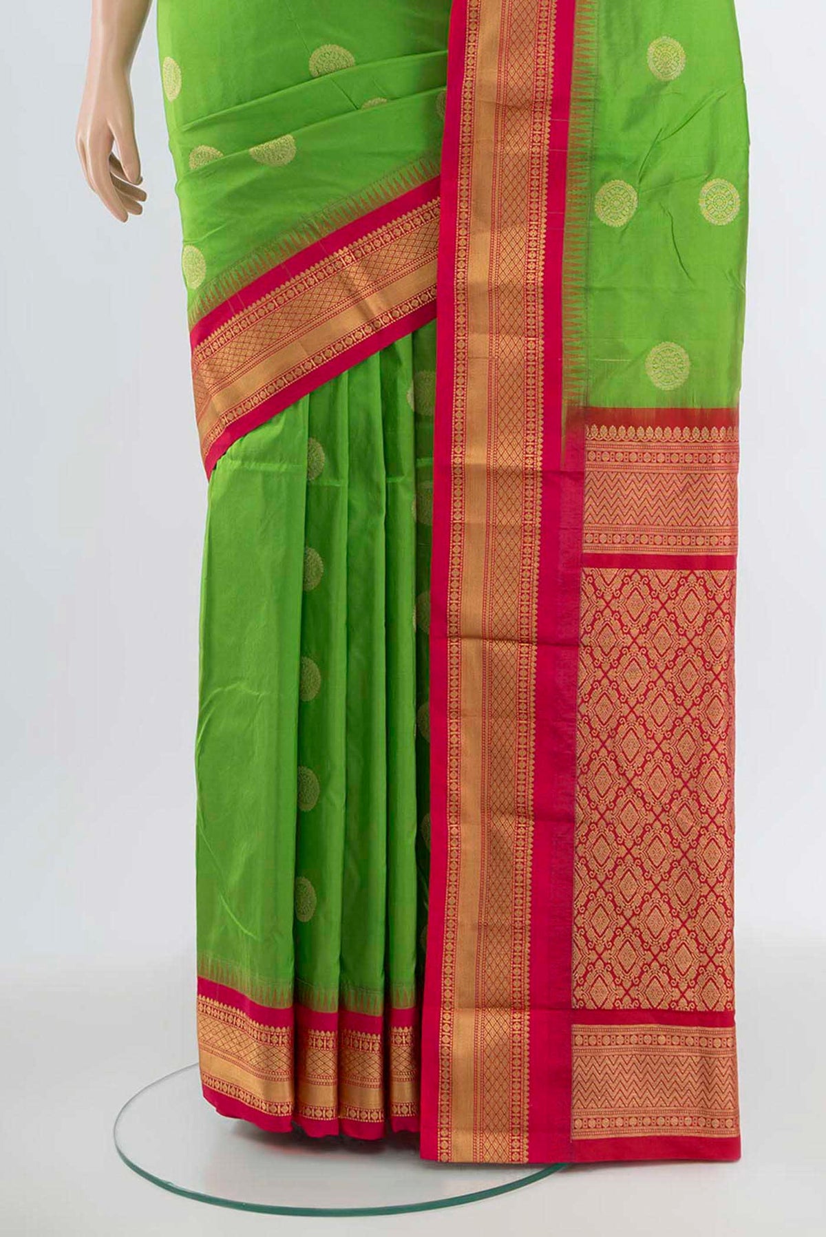 Pleats and pallu of Parrot Green Bangalore Silk Saree with Zari Butta on the body and Silk Border. 
