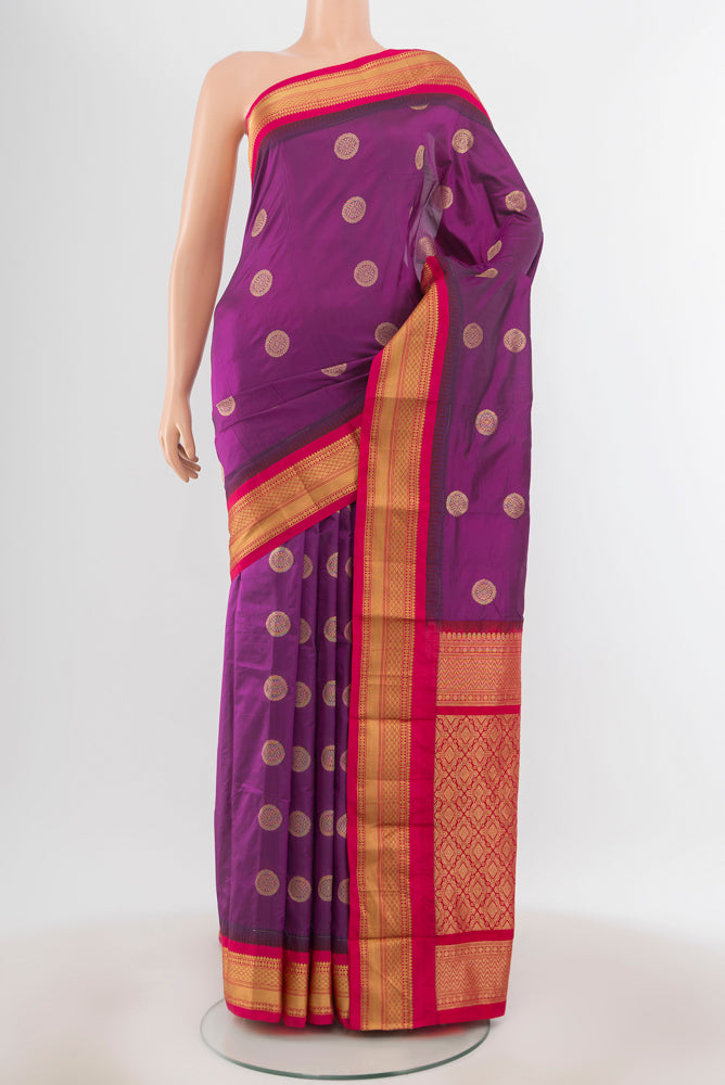 Pure Silk Pure Zari Purple Bangalore Saree with Zari Butta on the body and Silk Border.  displayed on a mannequin