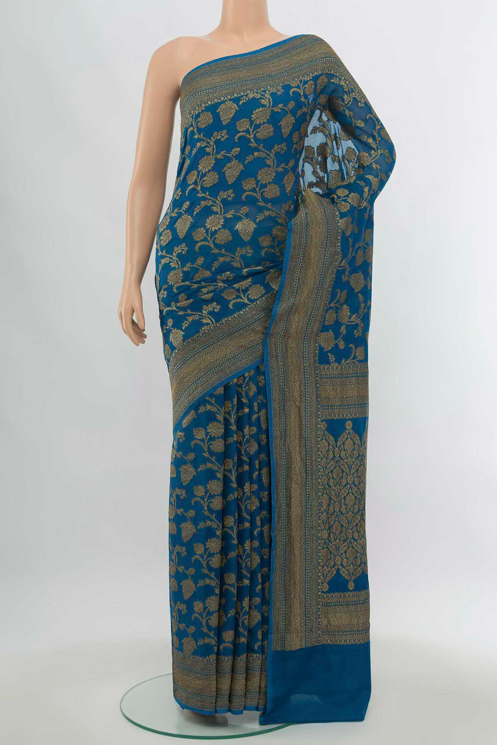 Light Blue Banarasi Georgette Saree with Zari Butta on the body and Silk Border.  displayed on a mannequin