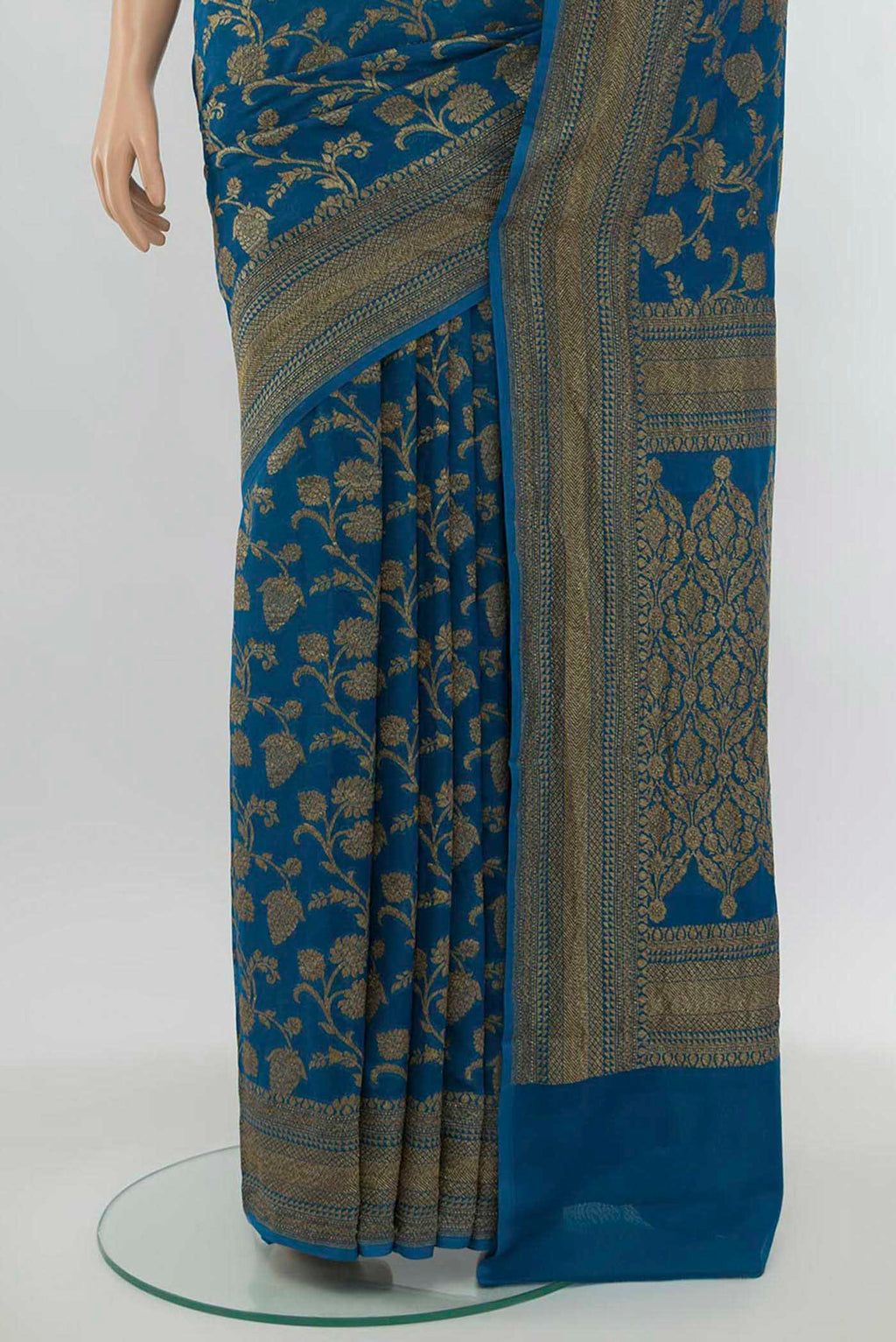 Pleats and pallu of Light Blue Banarasi Georgette Saree with Zari Butta on the body and Silk Border. 