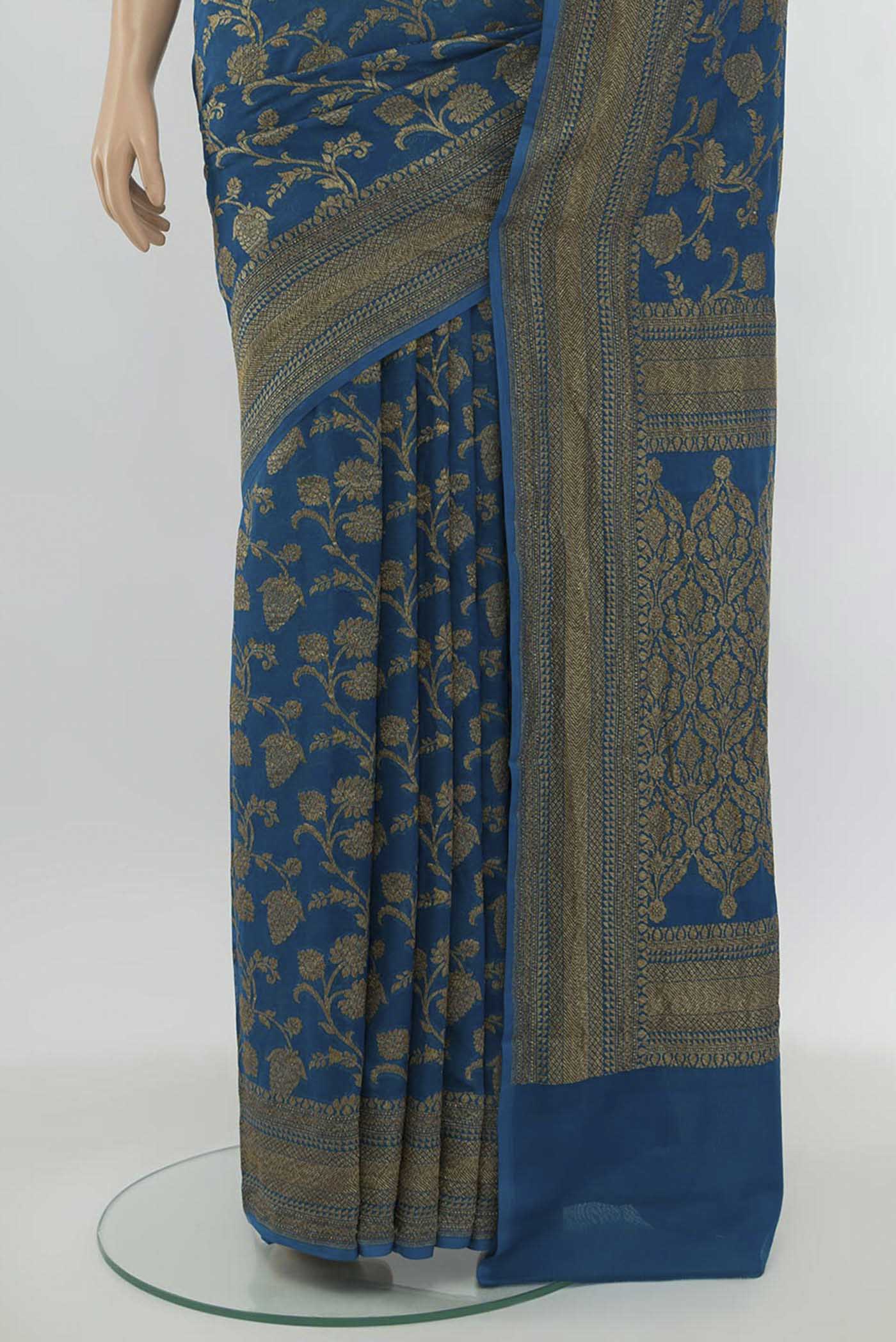 Pleats and pallu of Light Blue Banarasi Georgette Saree with Zari Butta on the body and Silk Border. 