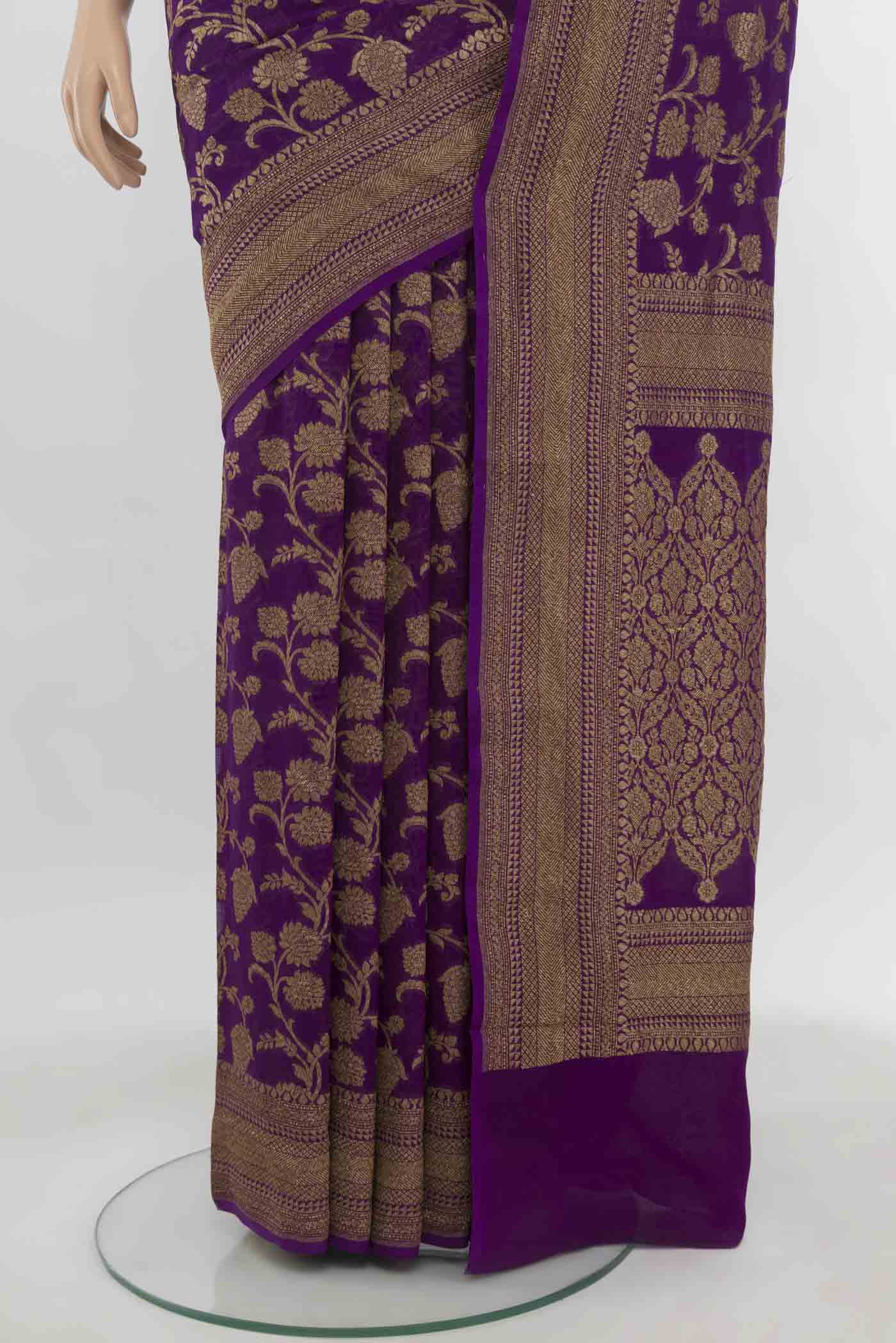 Pleats and pallu of Purple Banarasi Georgette Saree with Zari Butta on the body and Zari Border. 