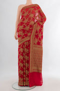 Red Banarasi Georgette Saree with Zari Brocade on the body and Zari Border.  displayed on a mannequin