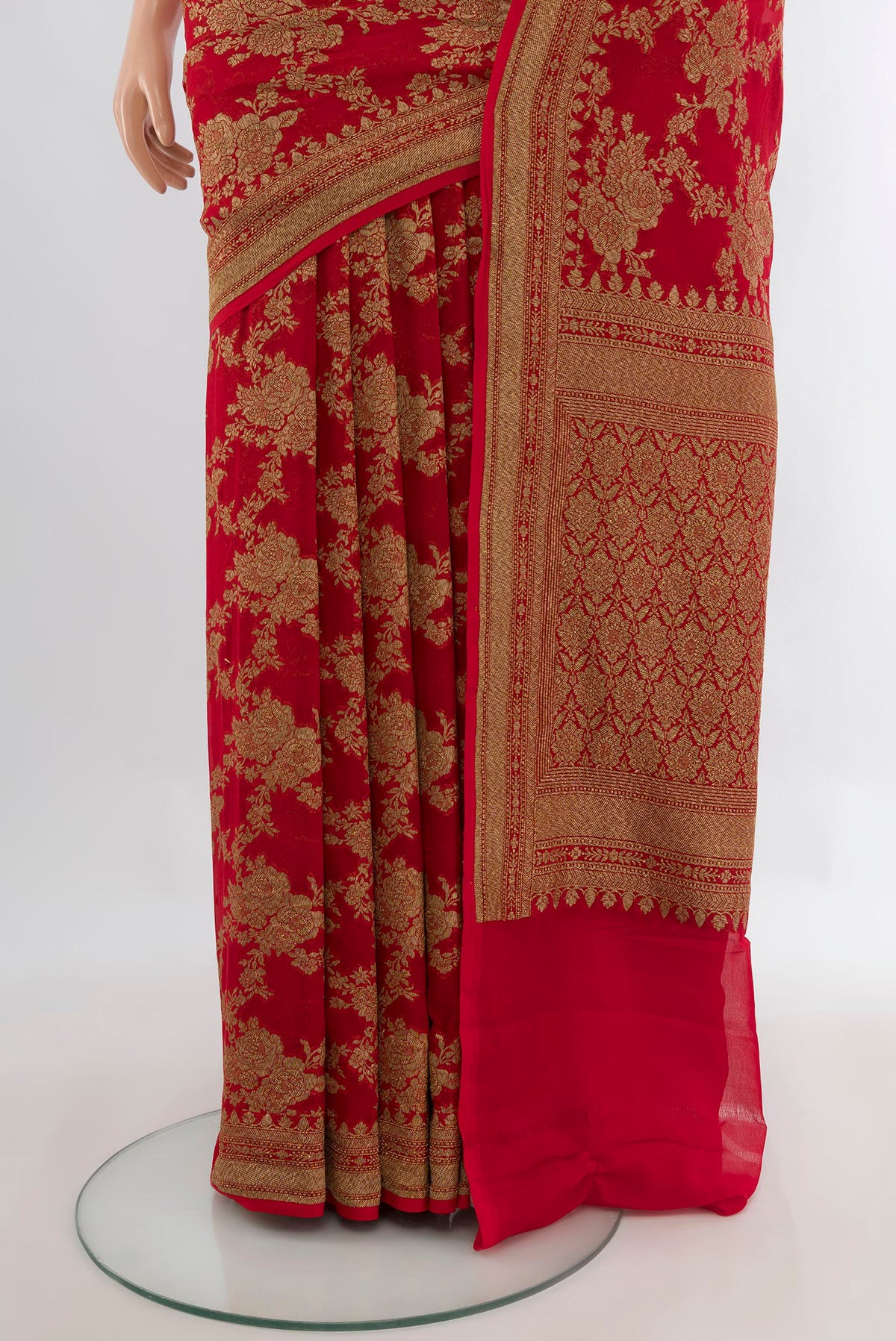 Pleats and pallu of Red Banarasi Georgette Saree with Zari Brocade on the body and Zari Border. 