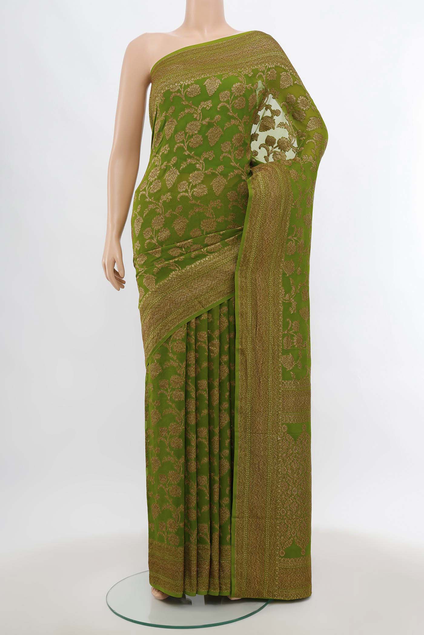 Light Green Banarasi Georgette Saree with Zari Butta on the body and Silk Border.  displayed on a mannequin