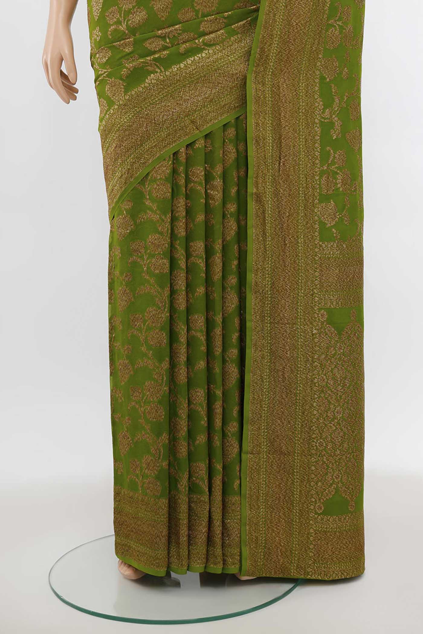Pleats and pallu of Light Green Banarasi Georgette Saree with Zari Butta on the body and Silk Border. 