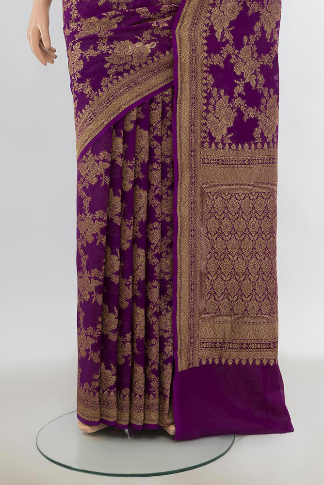 Pleats and pallu of Violet Banarasi Georgette Saree with Zari Butta on the body and Silk Border. 