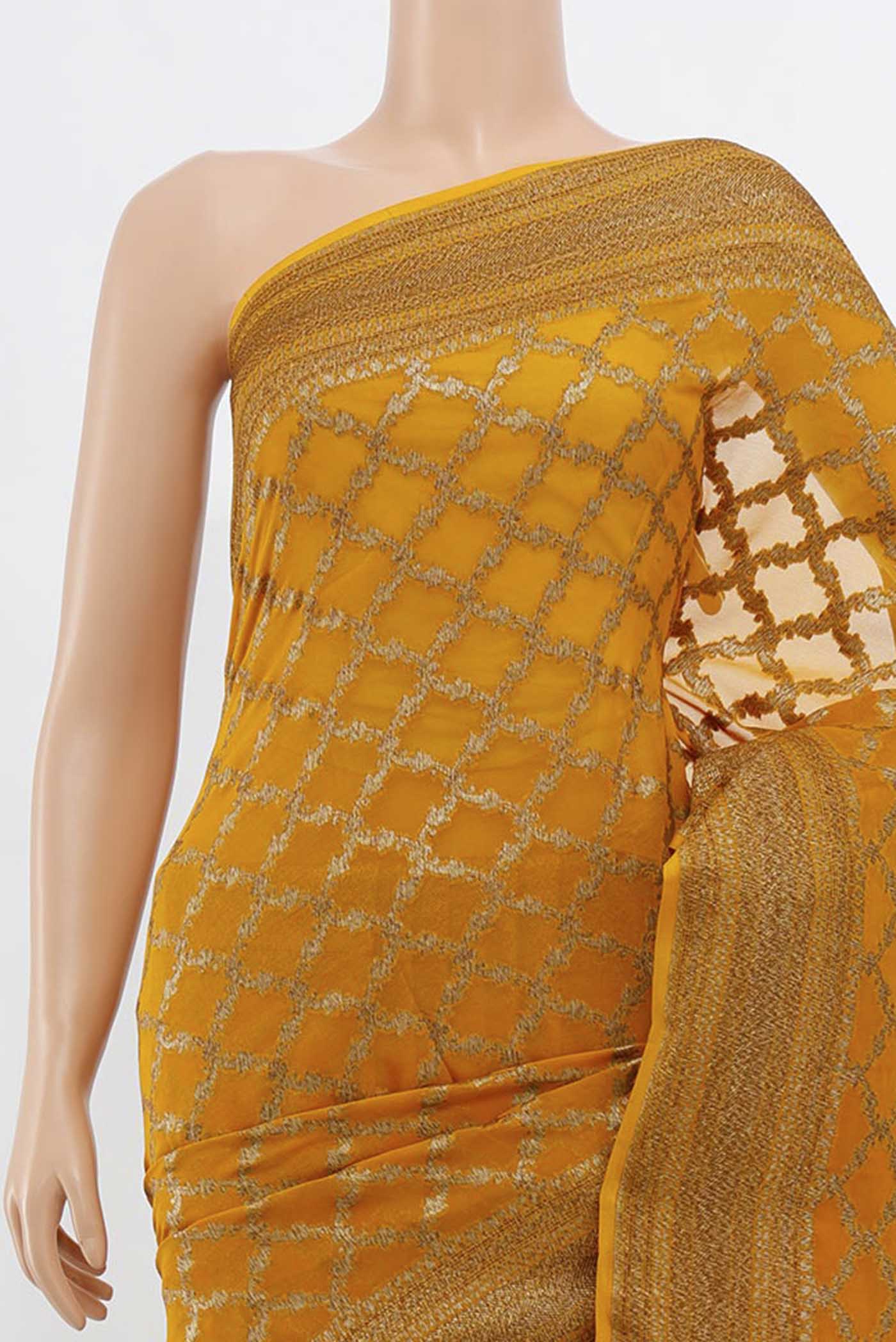 Border image of Mustard Banarasi Georgette Saree with Zari Butta on the body and Silk Border. 