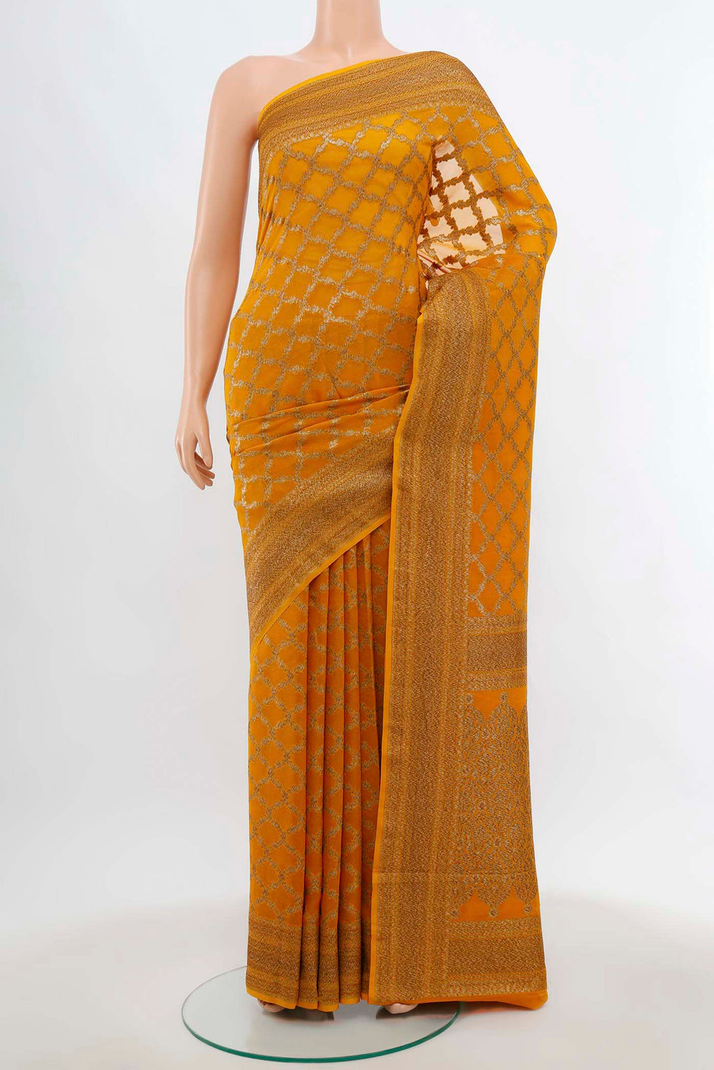 Mustard Banarasi Georgette Saree with Zari Butta on the body and Silk Border.  displayed on a mannequin