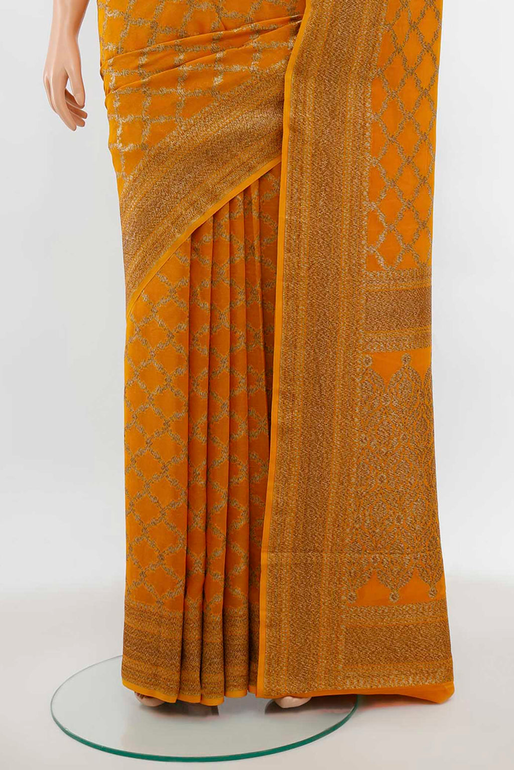 Pleats and pallu of Mustard Banarasi Georgette Saree with Zari Butta on the body and Silk Border. 